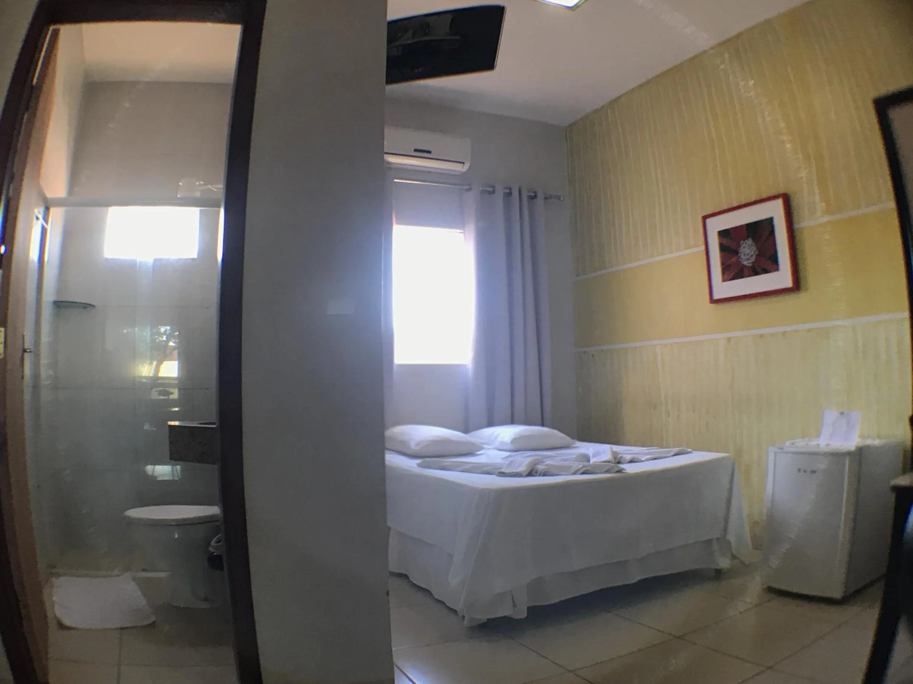 Bed in Hotel Pousada Calliandra