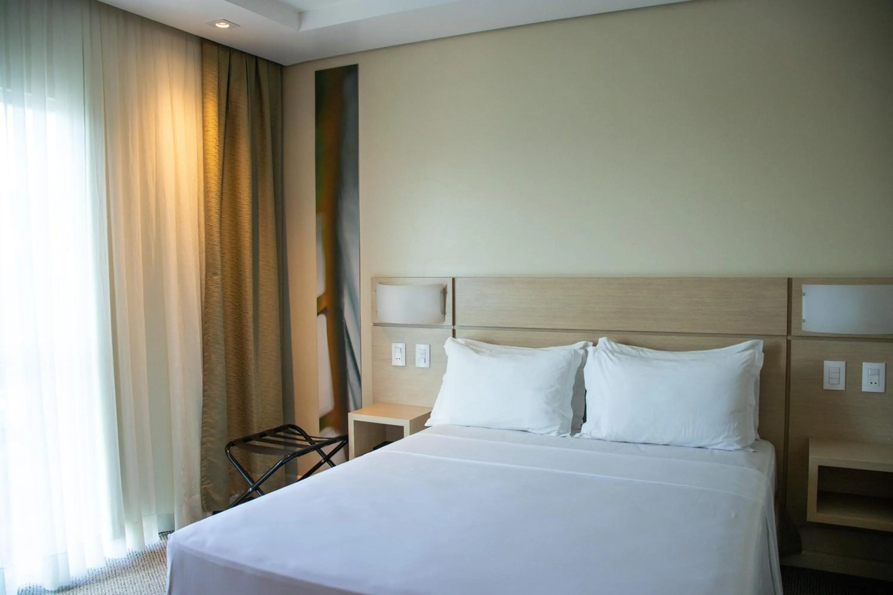 Bed in Kayrós Business Hotel