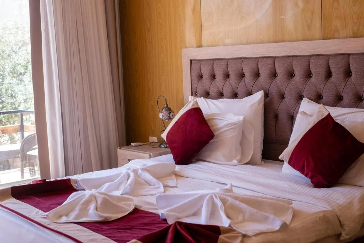 Bed in Al Sultana Luxury Camp