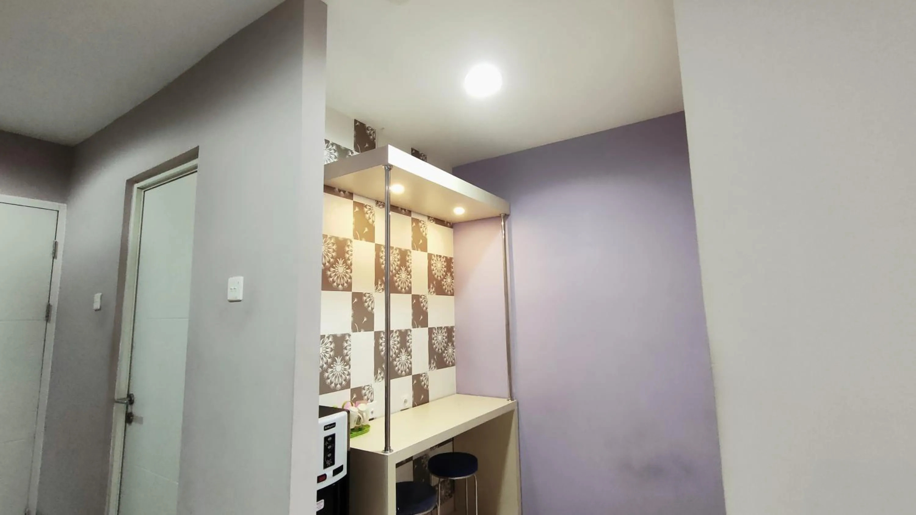 Dining area in Kozy Room Sentul Tower Apartemen