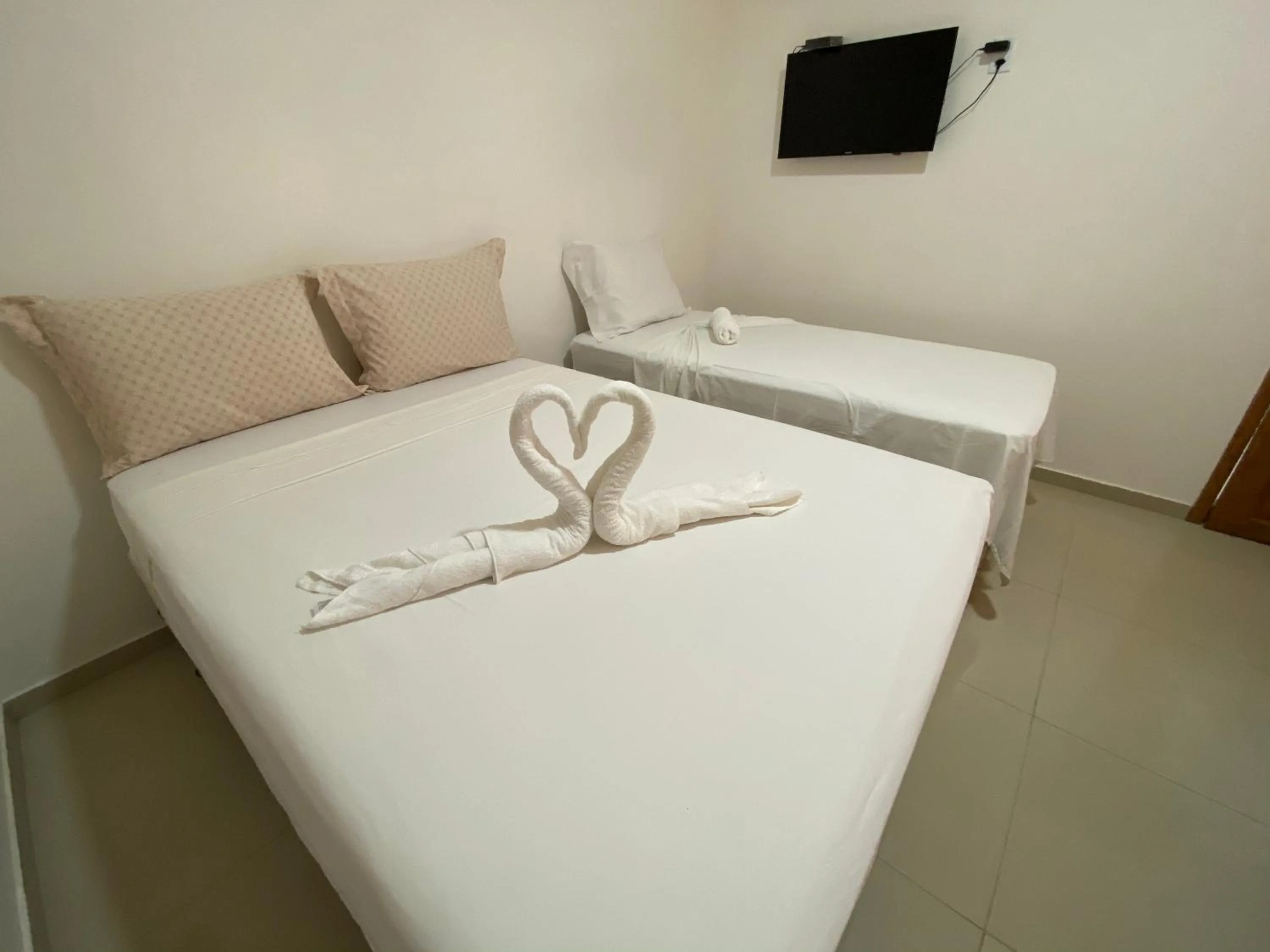 Bed in Pousada Casa da Cion