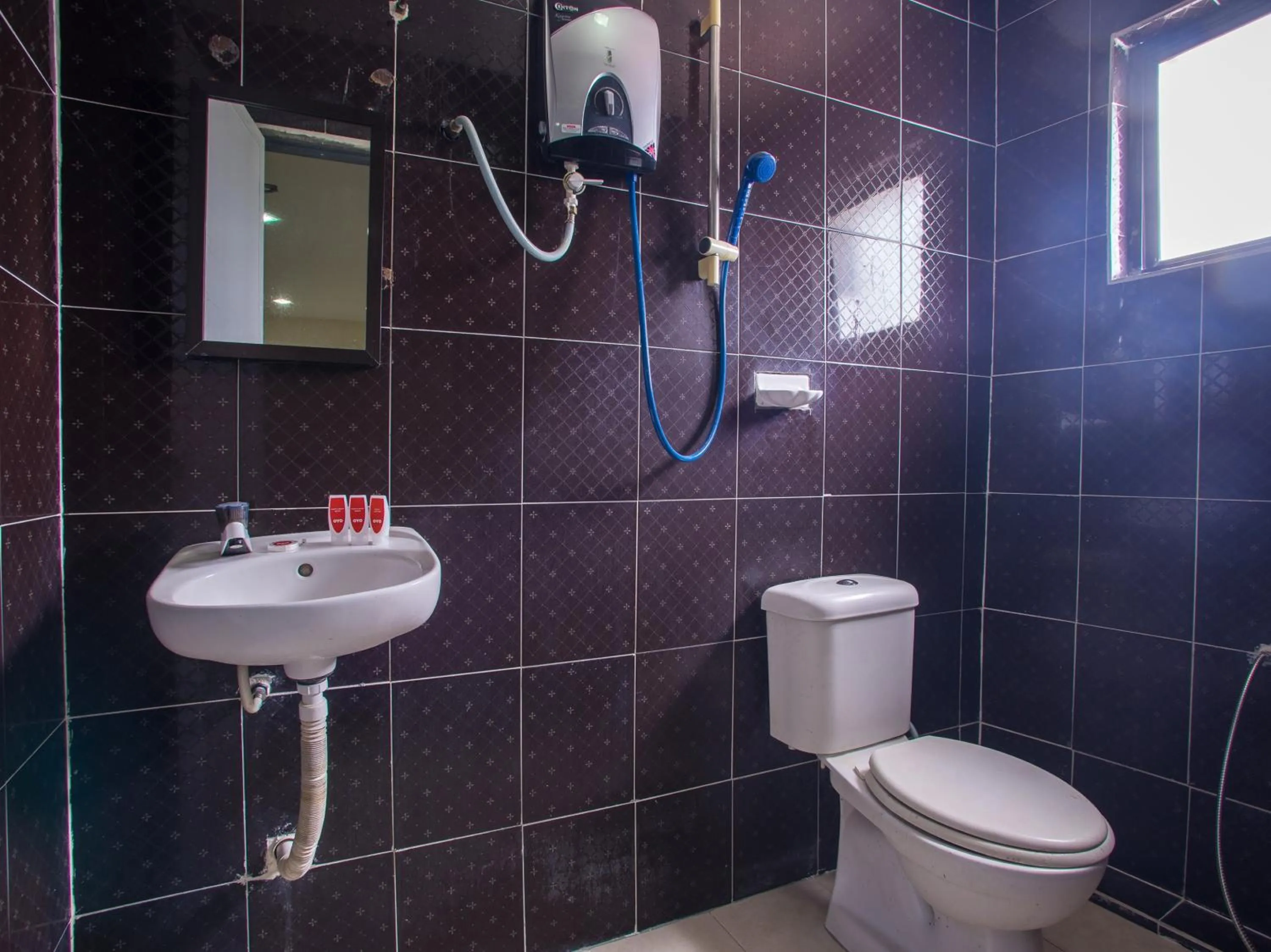 Bathroom in OYO 44010 Royals Star Hotel