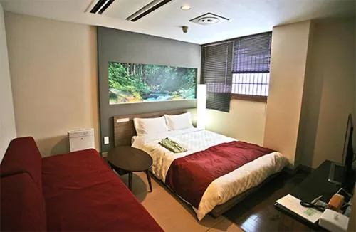 Photo of the whole room, Bed in Hiroshima Intelligent Hotel Stadium Mae