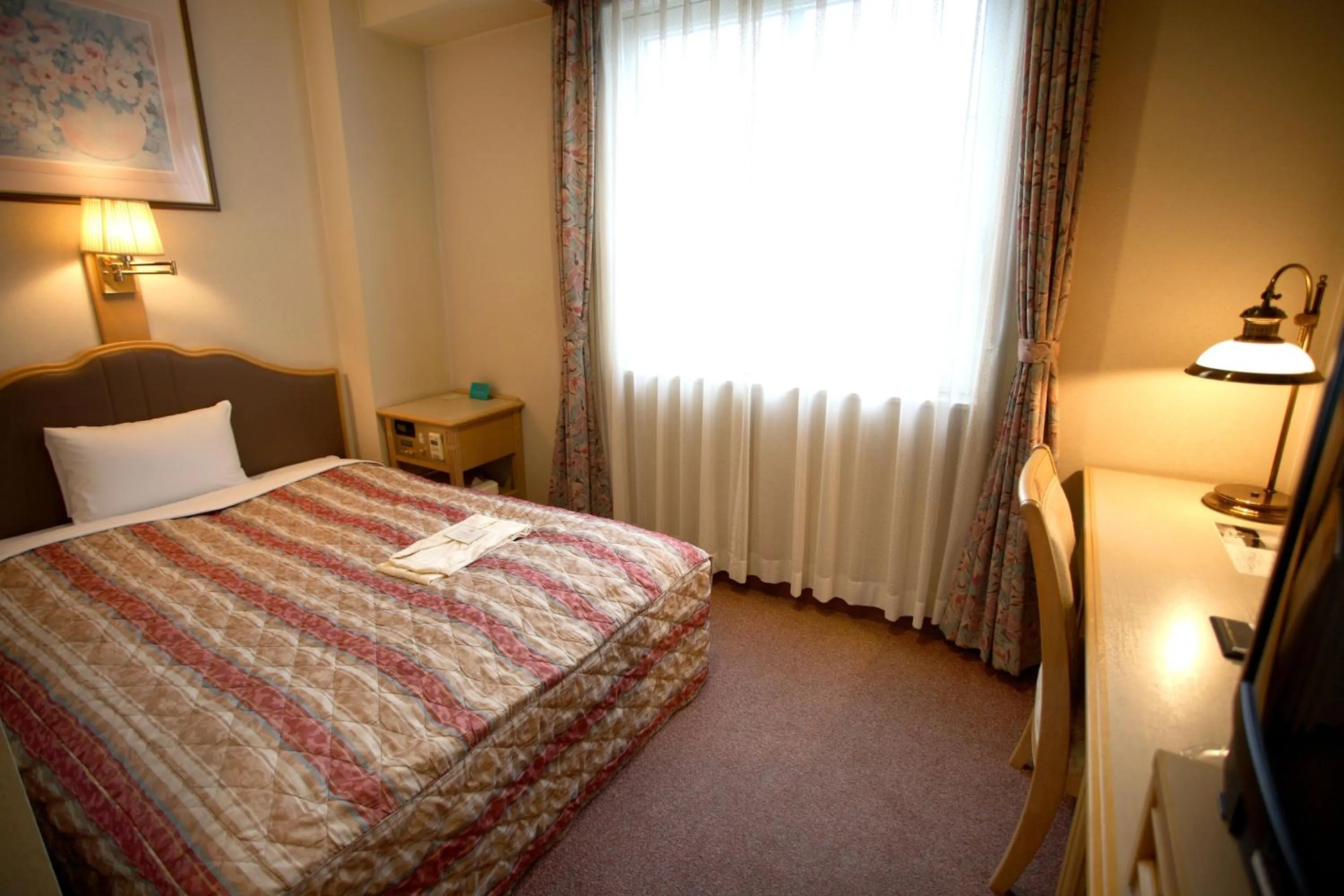 Photo of the whole room, Bed in Hiroshima Intelligent Hotel Stadium Mae