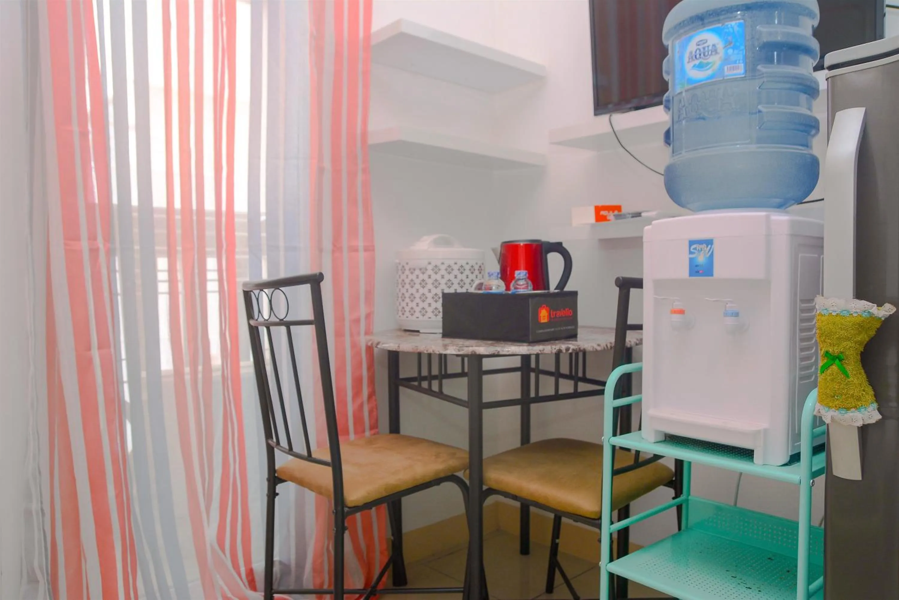 Dining area in Green Bay Pluit Studio Apartment with 2 Single Beds By Travelio