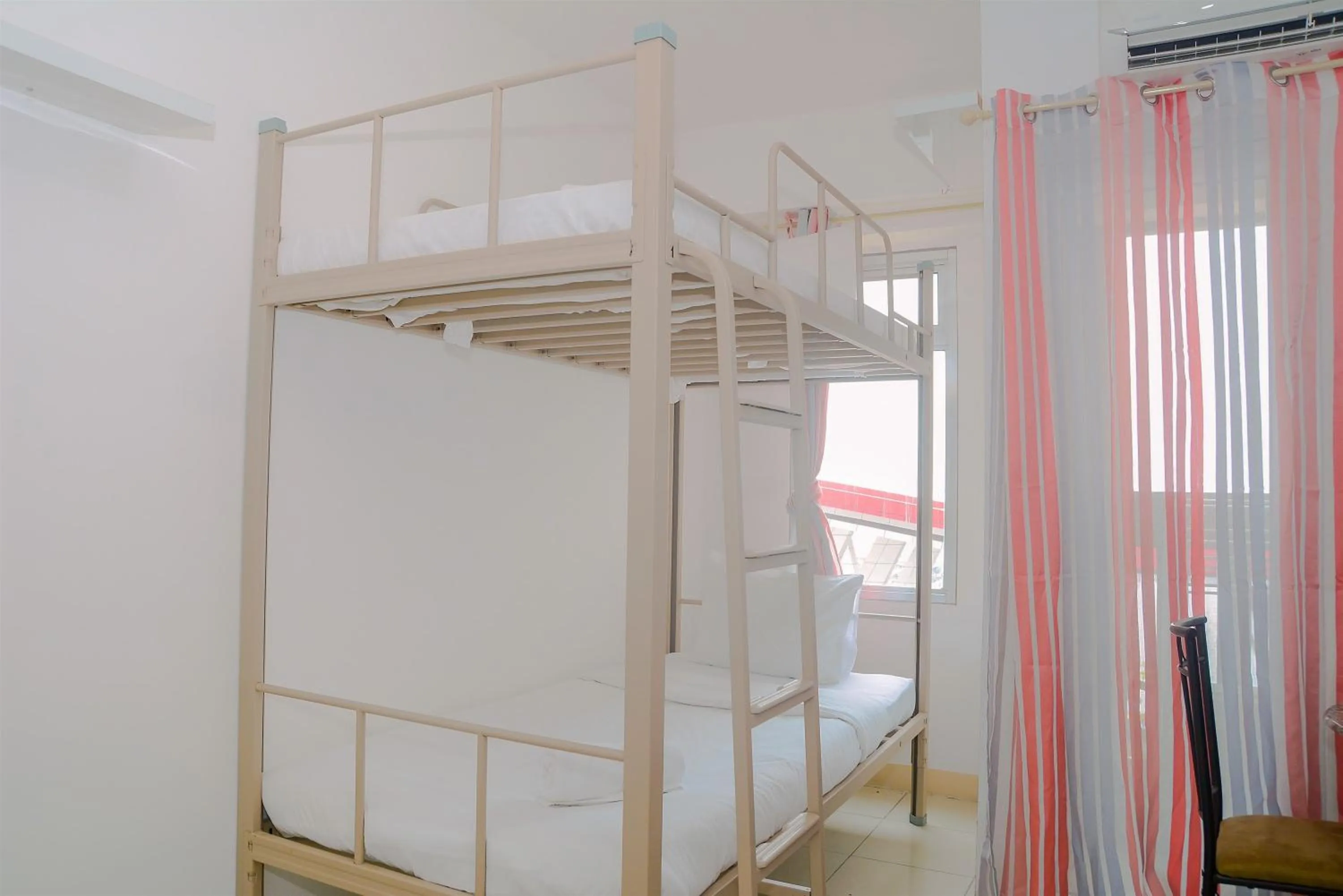 Bed in Green Bay Pluit Studio Apartment with 2 Single Beds By Travelio