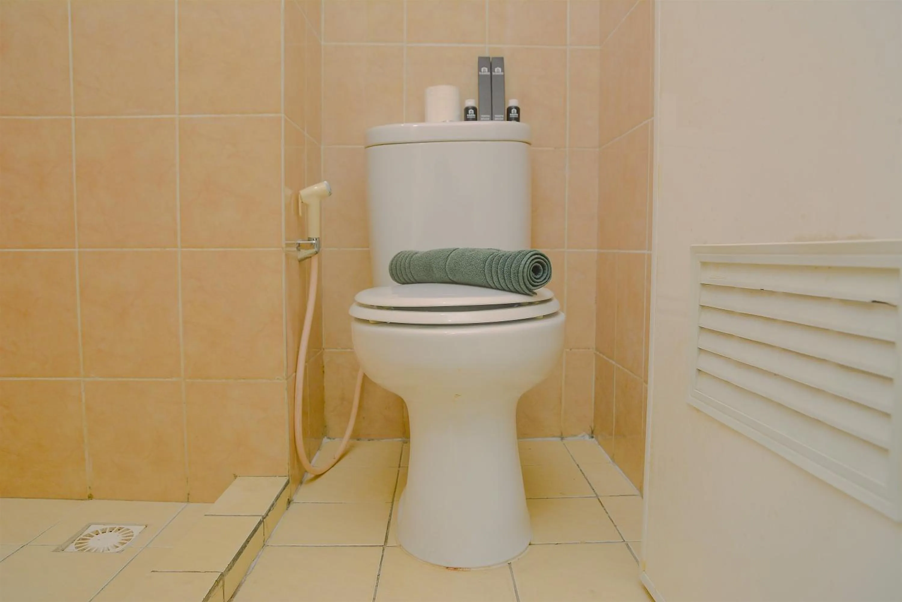 Bathroom in Green Bay Pluit Studio Apartment with 2 Single Beds By Travelio