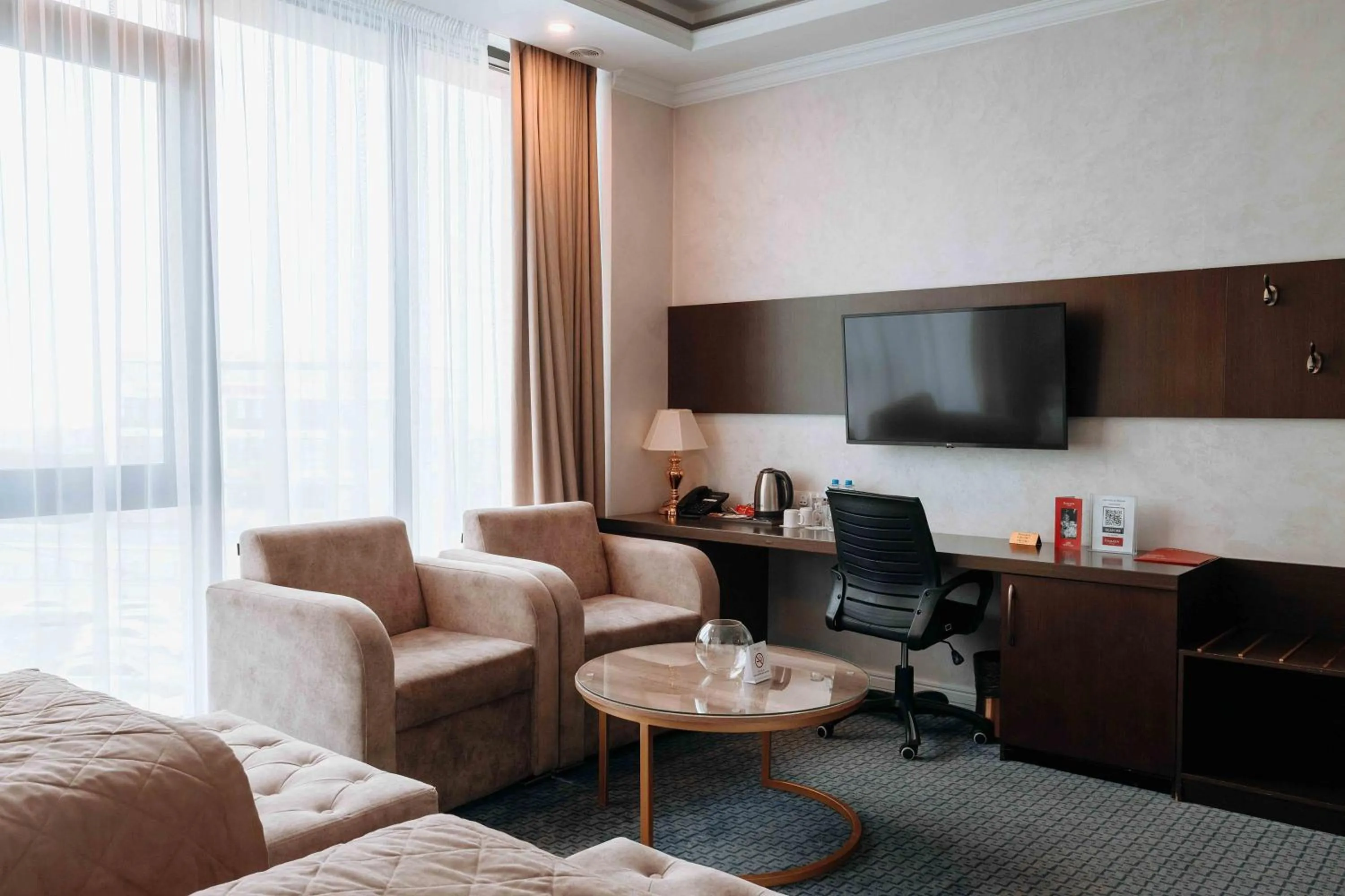 TV and multimedia in Ramada by Wyndham Shymkent