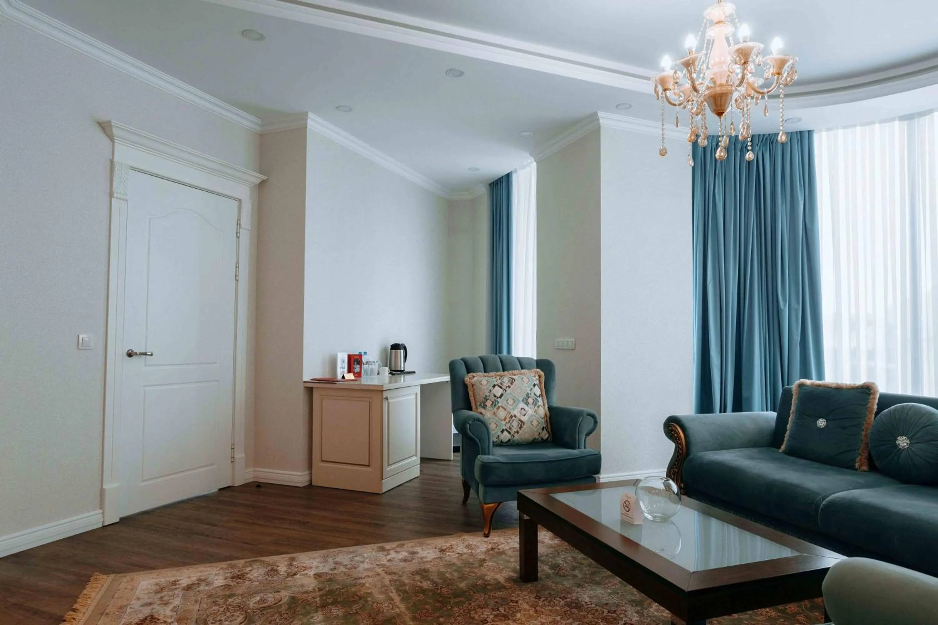 Living room in Ramada by Wyndham Shymkent