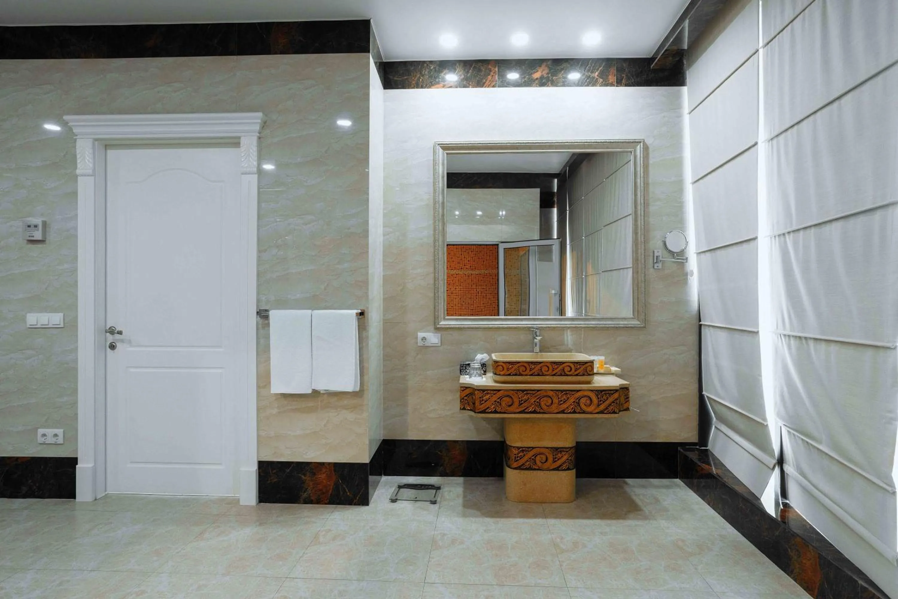 Bathroom in Ramada by Wyndham Shymkent