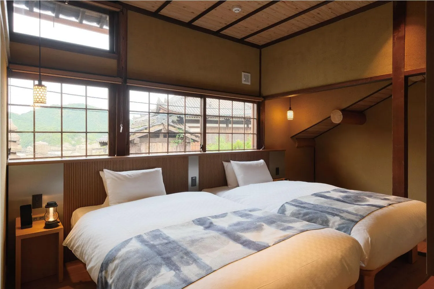 Bed in Tomonoura Shiomachi Hotel