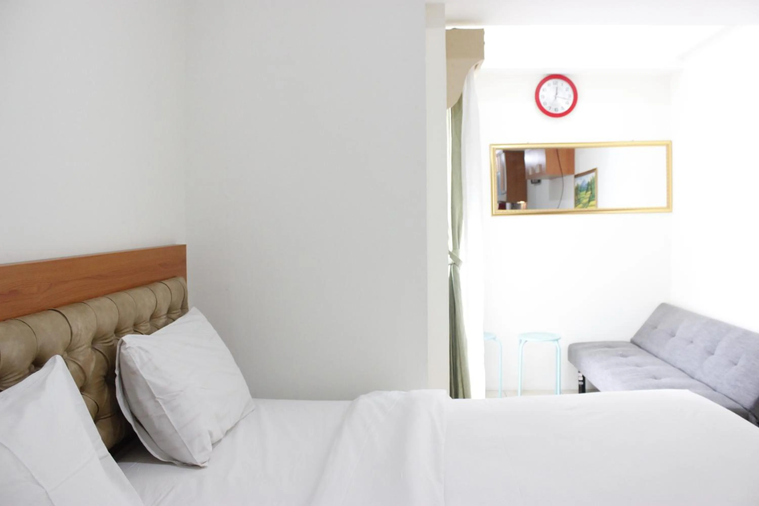 Bed in Compact Studio Tamansari Panoramic Apartment By Travelio