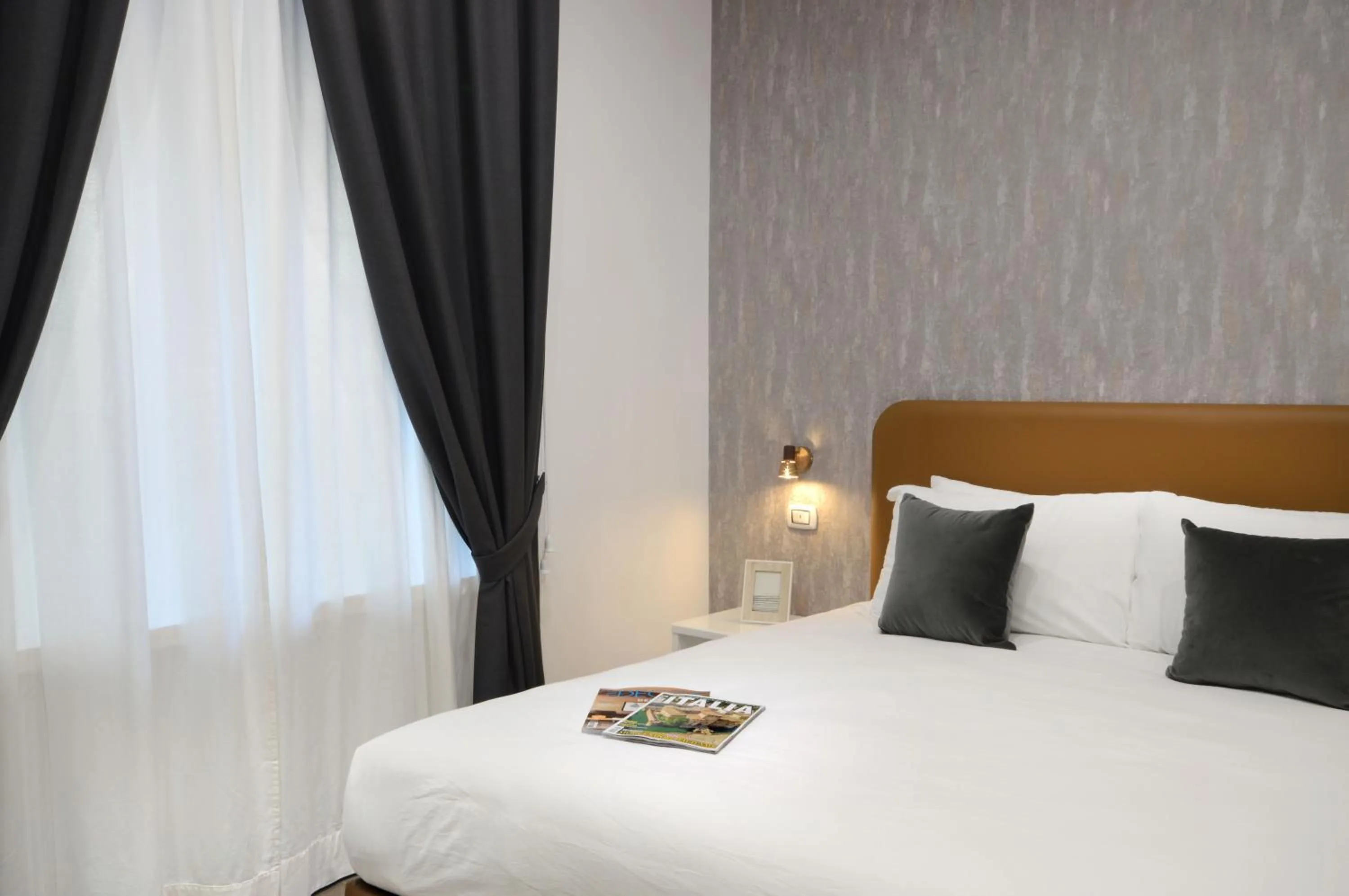 Bed in Napoliseason Rooms & Breakfast