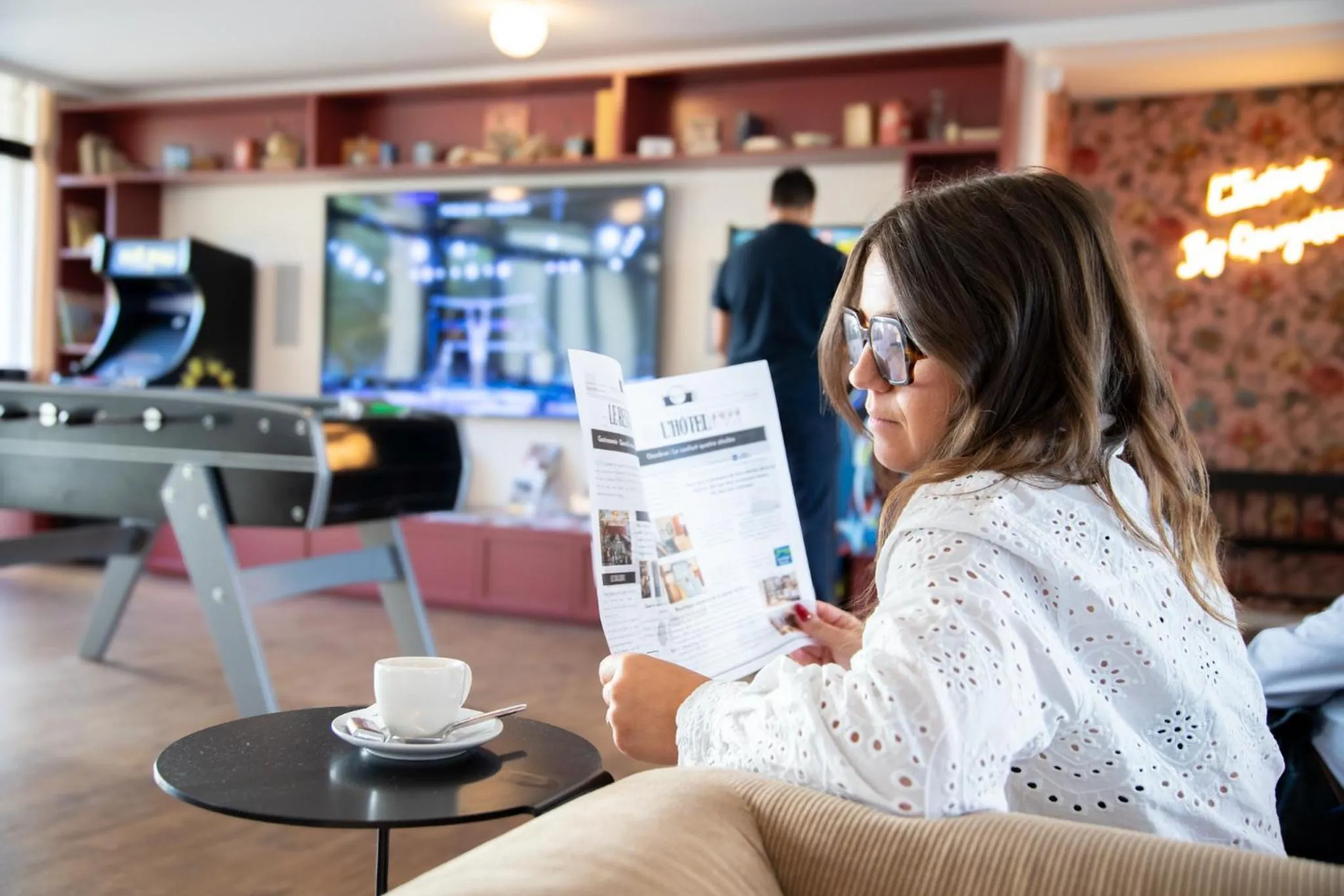 Communal lounge/ TV room in Best Western Porte du Forez