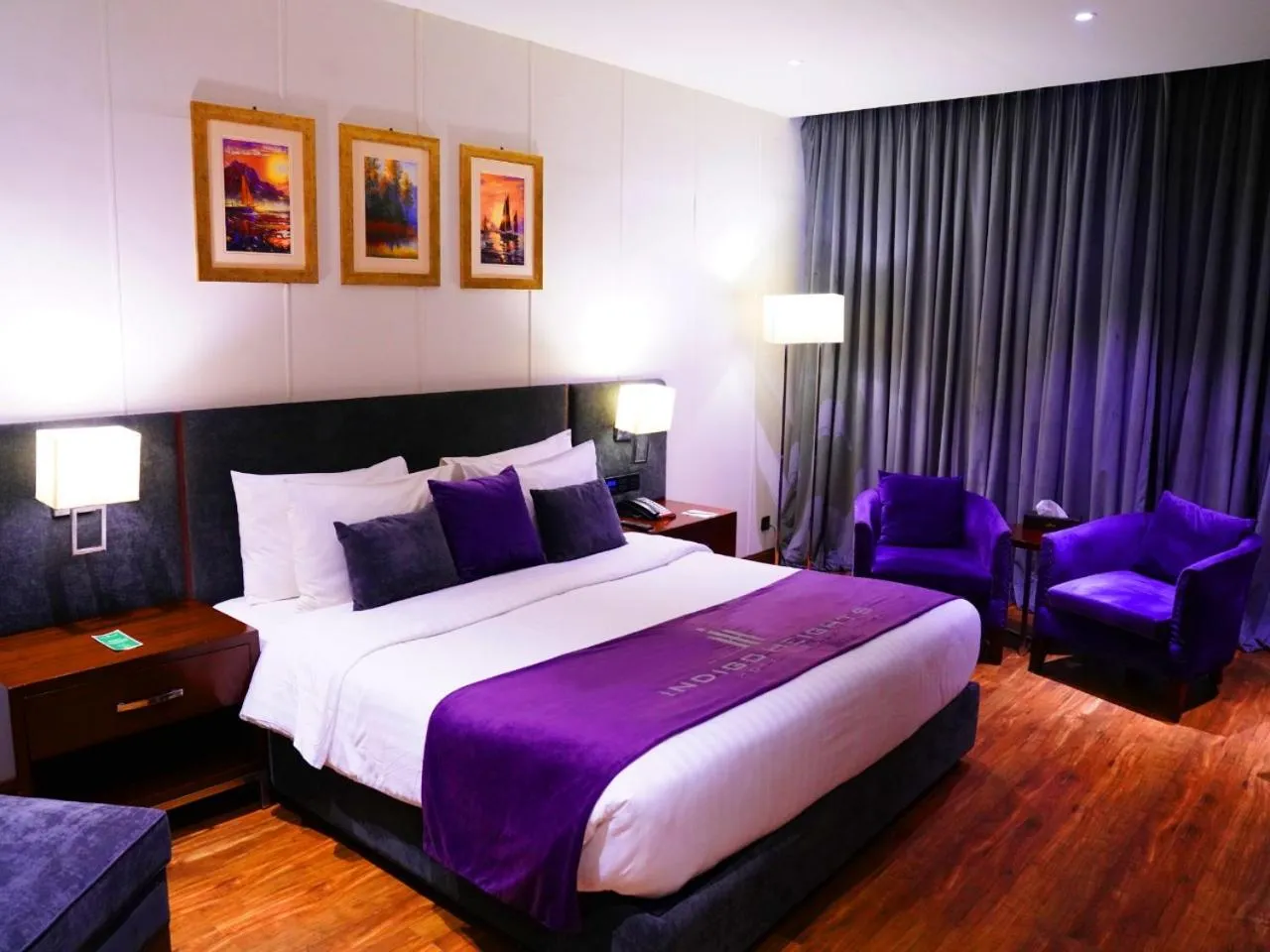 Bed in Indigo Heights Hotel & Suites