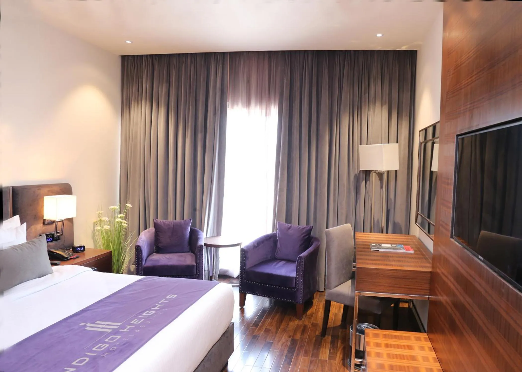 Bed in Indigo Heights Hotel & Suites