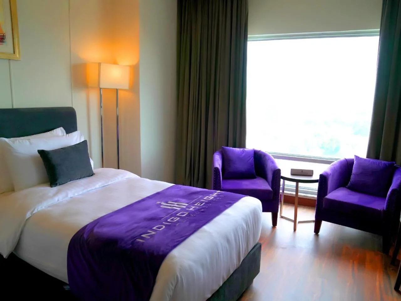 Bed in Indigo Heights Hotel & Suites