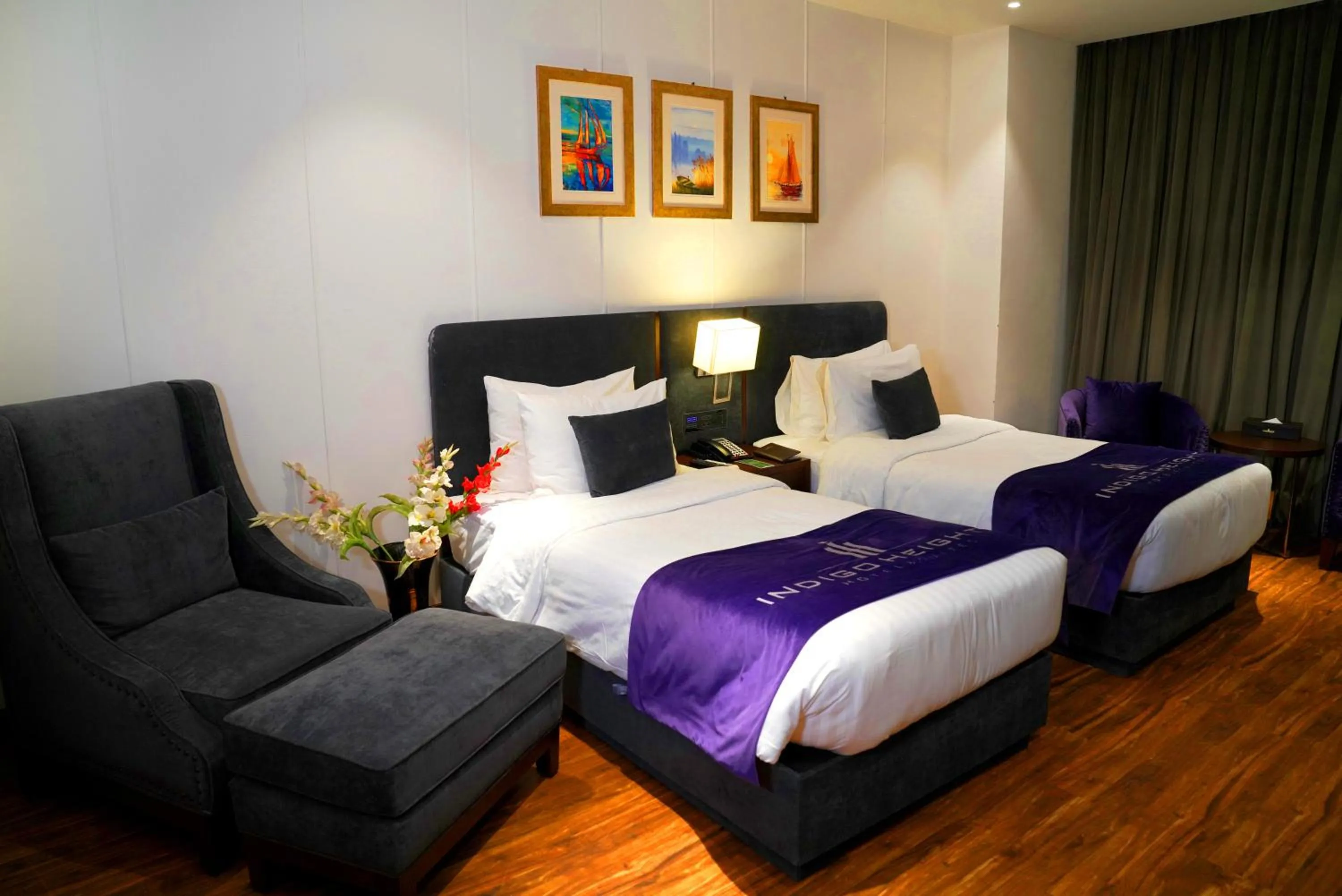 Bed in Indigo Heights Hotel & Suites