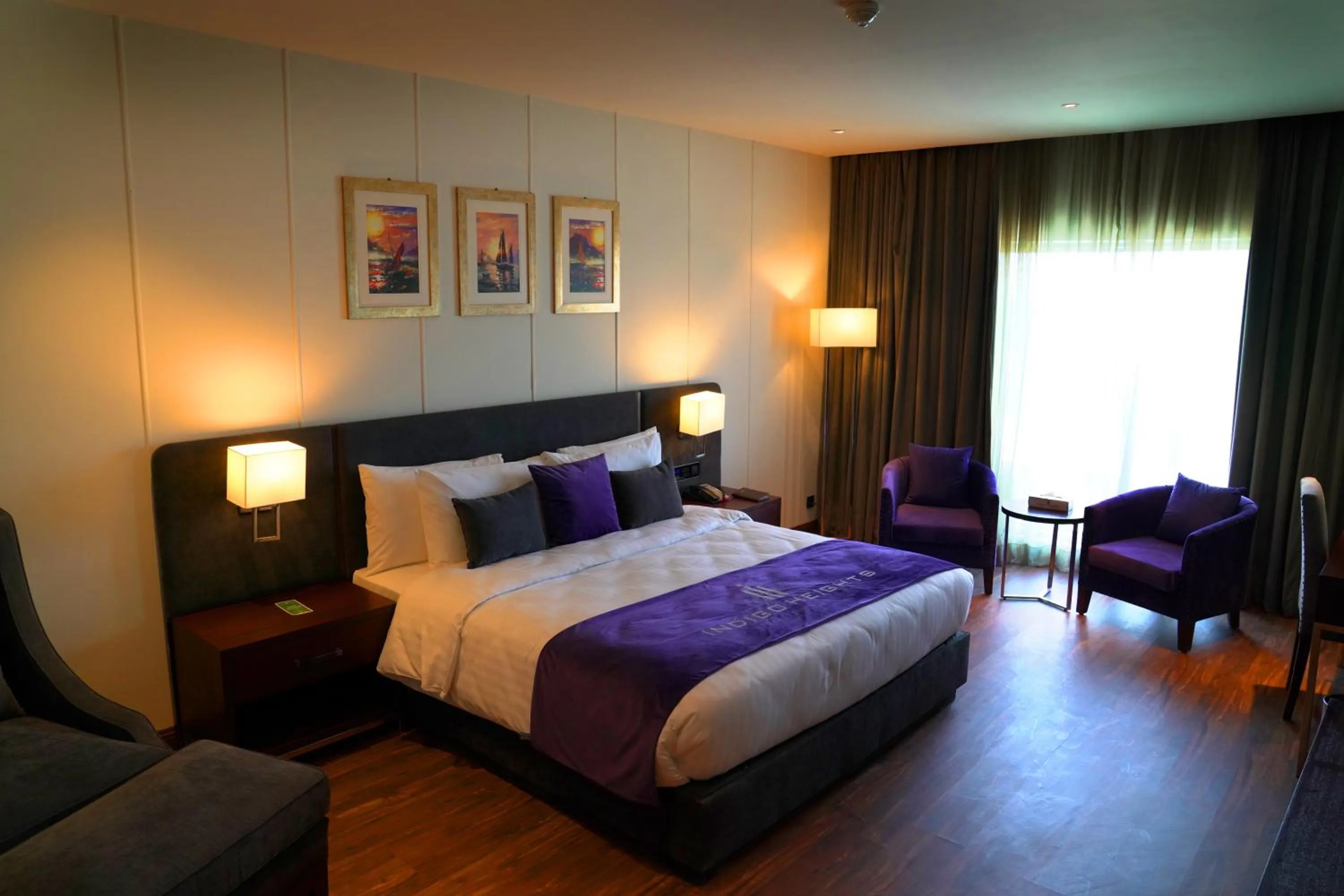 Bed in Indigo Heights Hotel & Suites