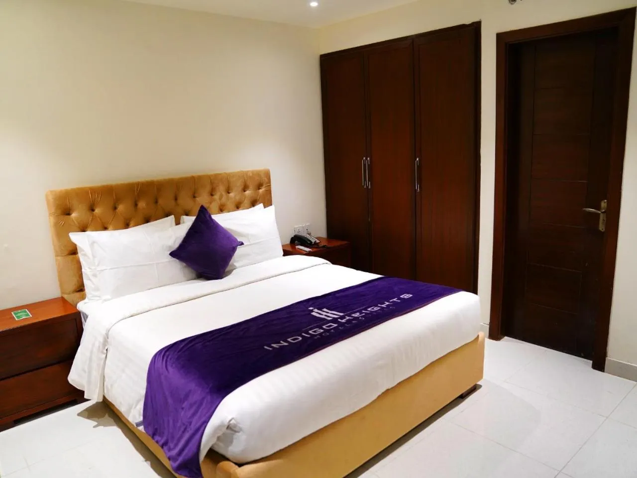 Bed in Indigo Heights Hotel & Suites