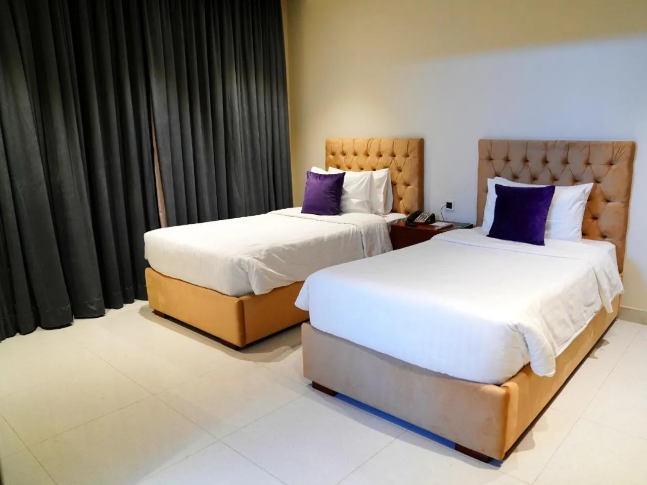 Bed in Indigo Heights Hotel & Suites