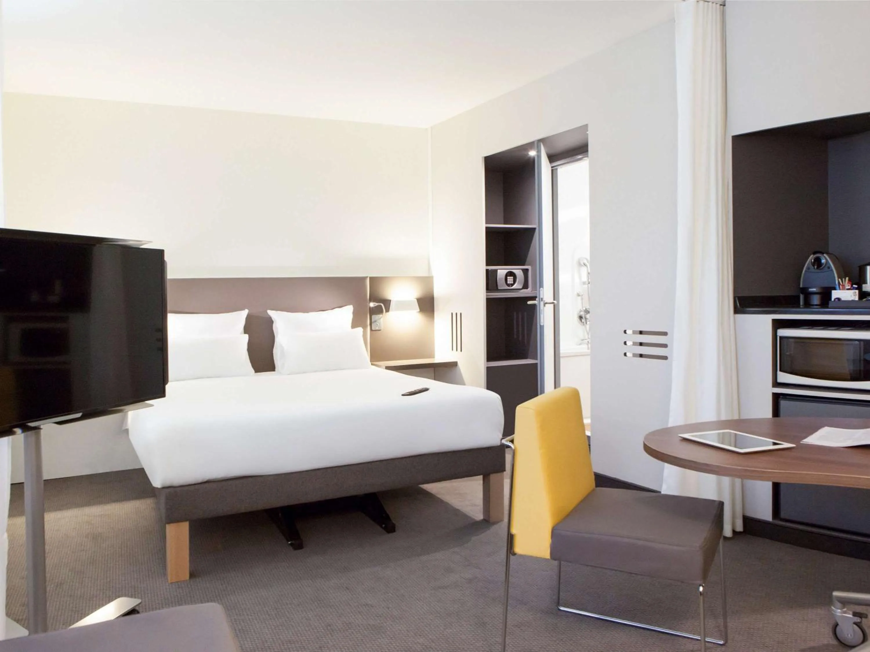 Photo of the whole room, Bed in Novotel Suites Paris Stade de France