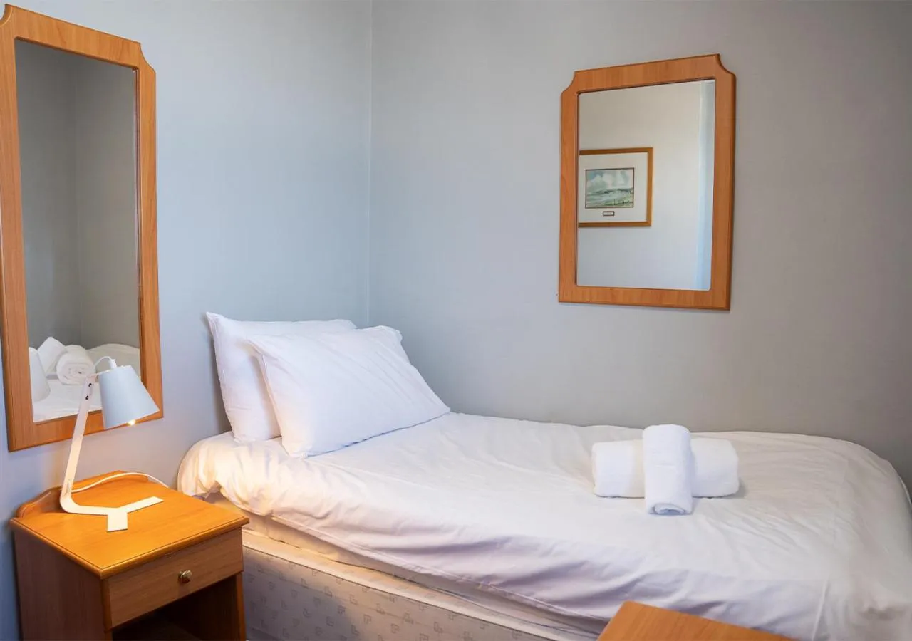 Bed in The Seafront Hotel by Compass Hospitality