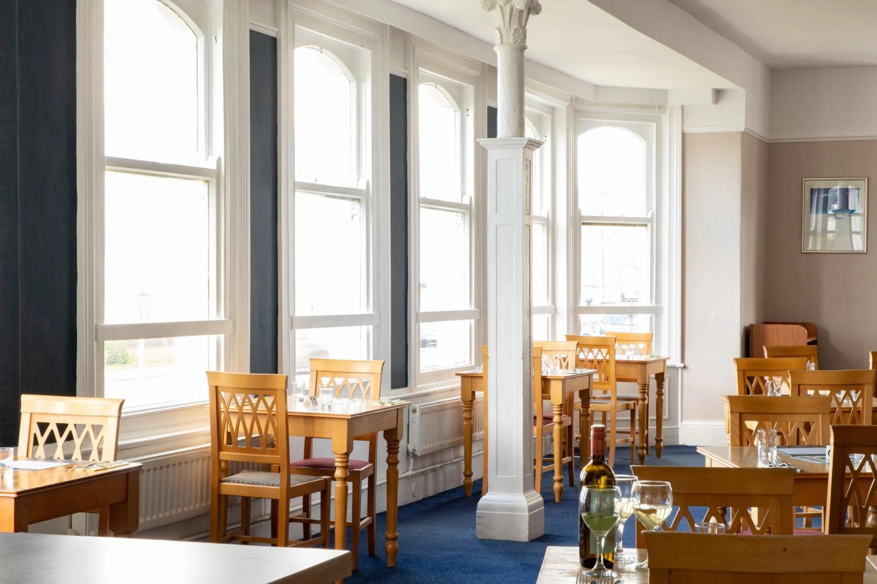 Dining area in The Seafront Hotel by Compass Hospitality