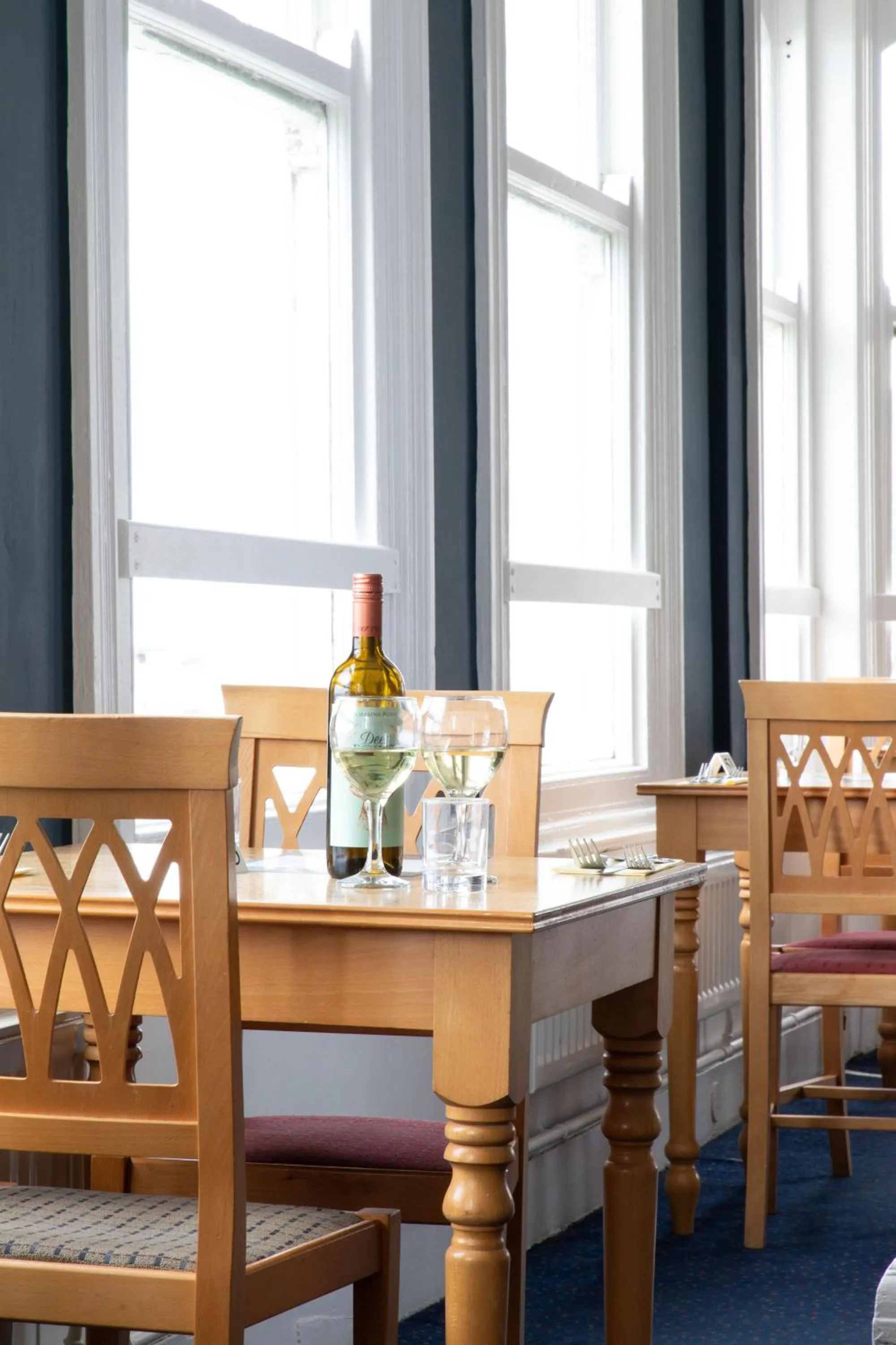 Dining area in The Seafront Hotel by Compass Hospitality