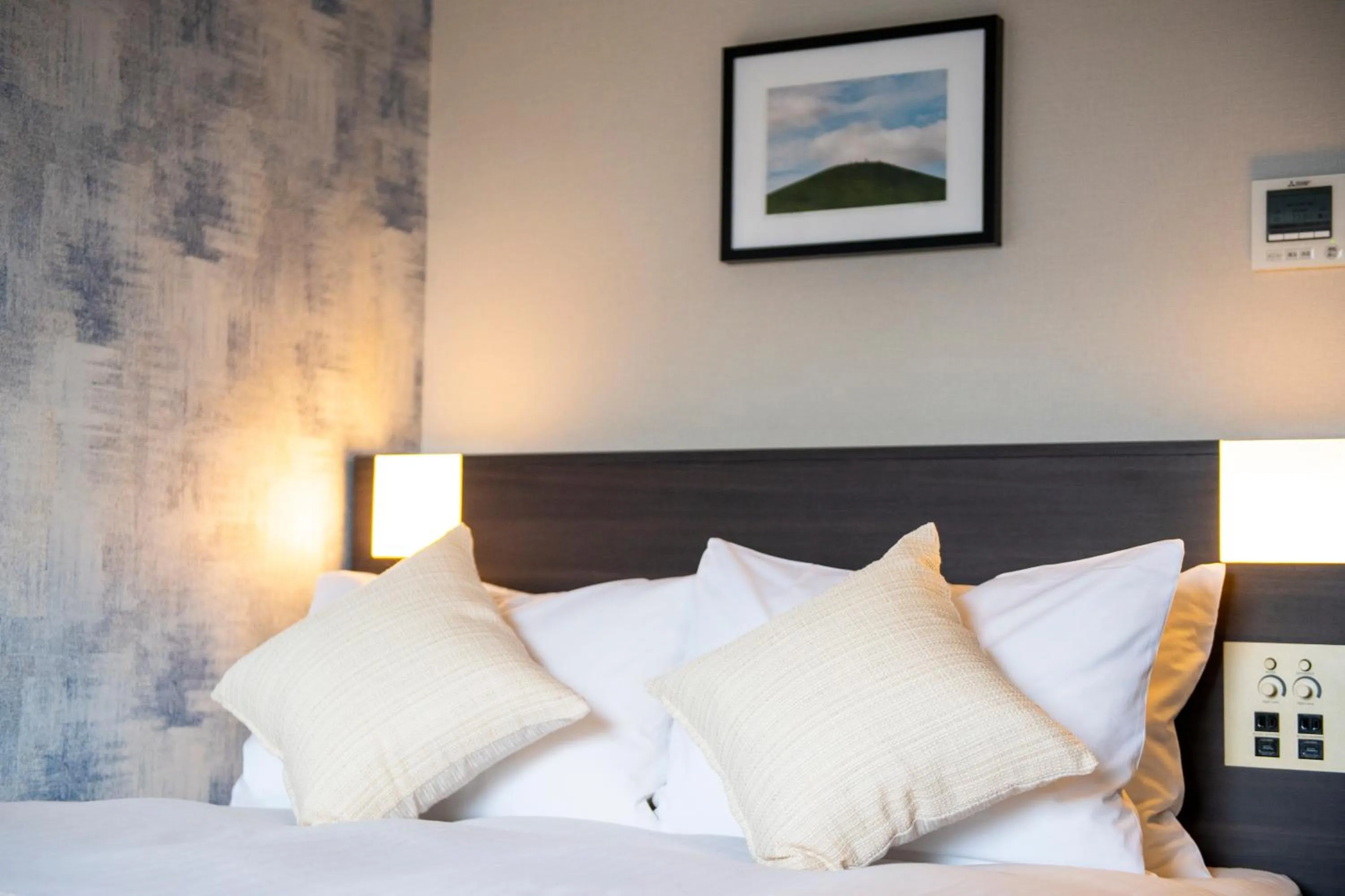 Bed in KOKO HOTEL Sapporo Odori