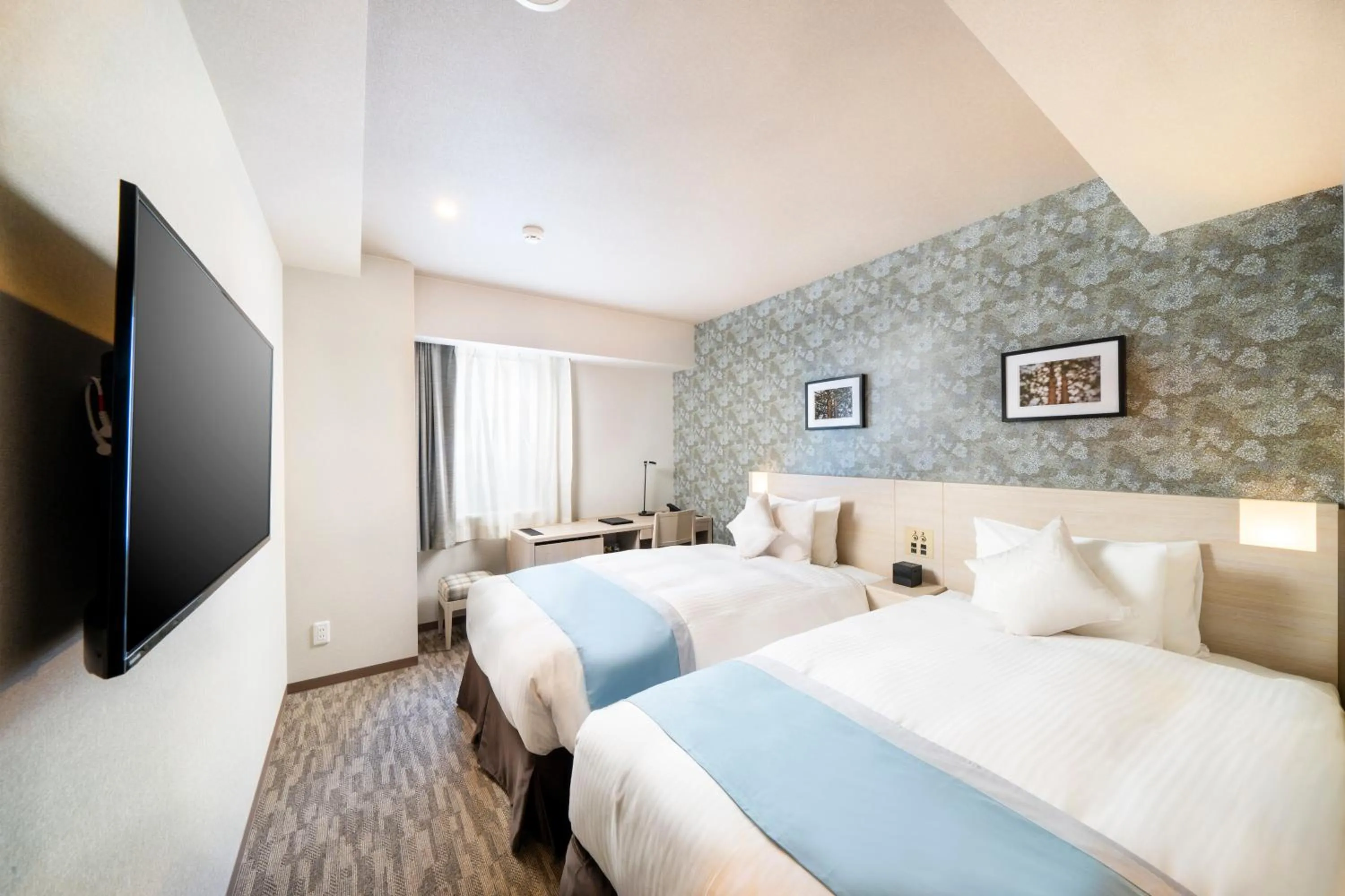 Bed in KOKO HOTEL Sapporo Odori