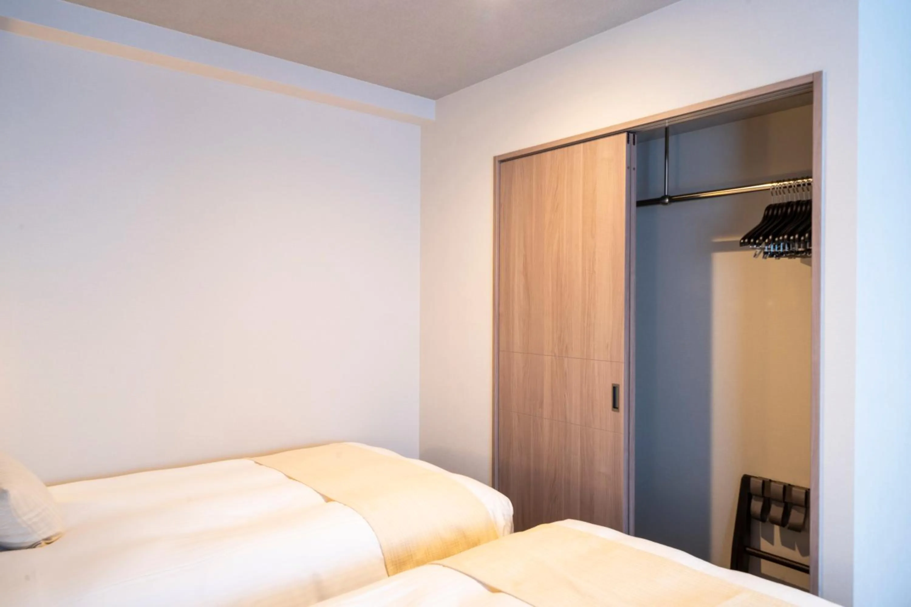 Bed in KOKO HOTEL Sapporo Odori