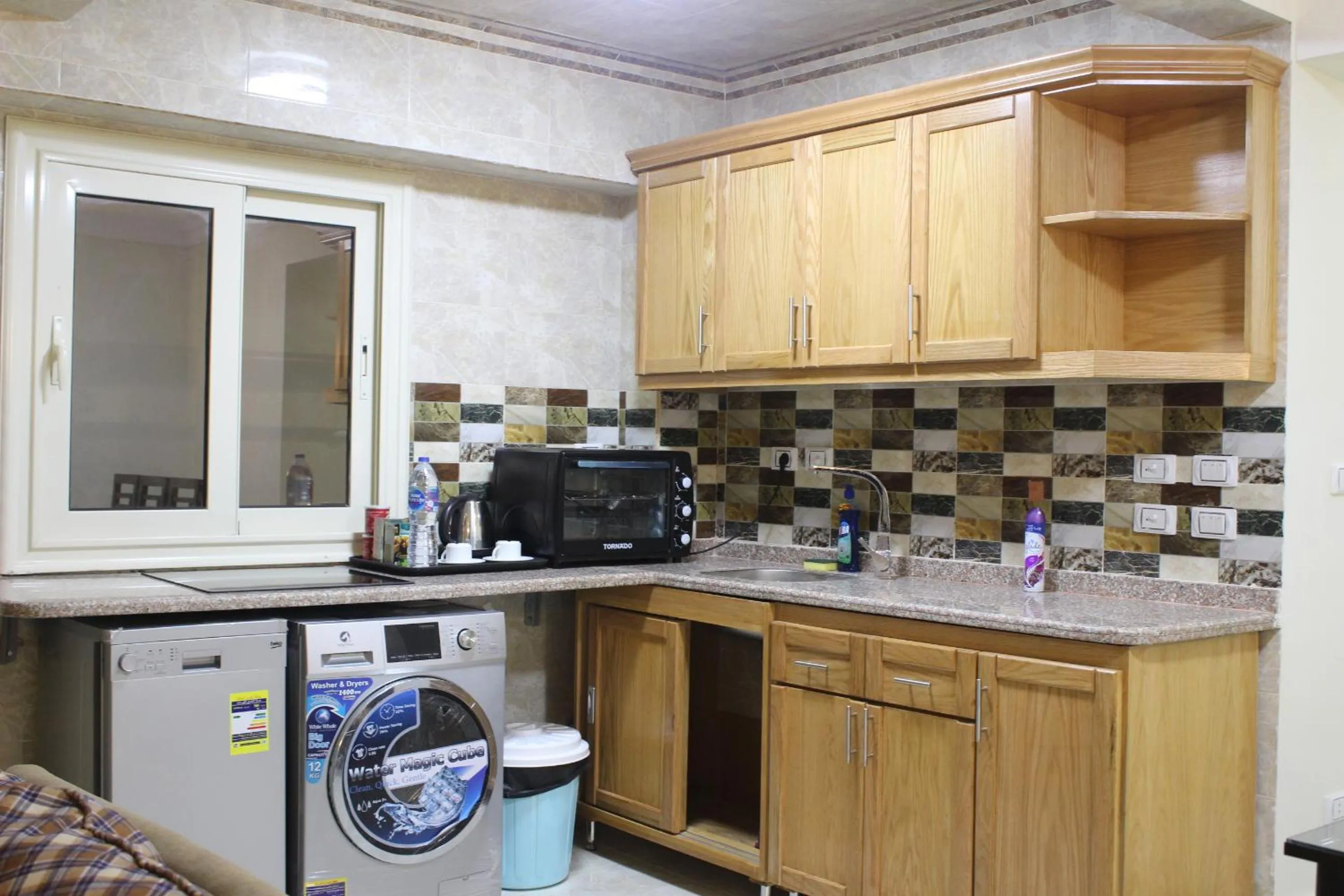 Kitchen or kitchenette in Al Raya Apartments