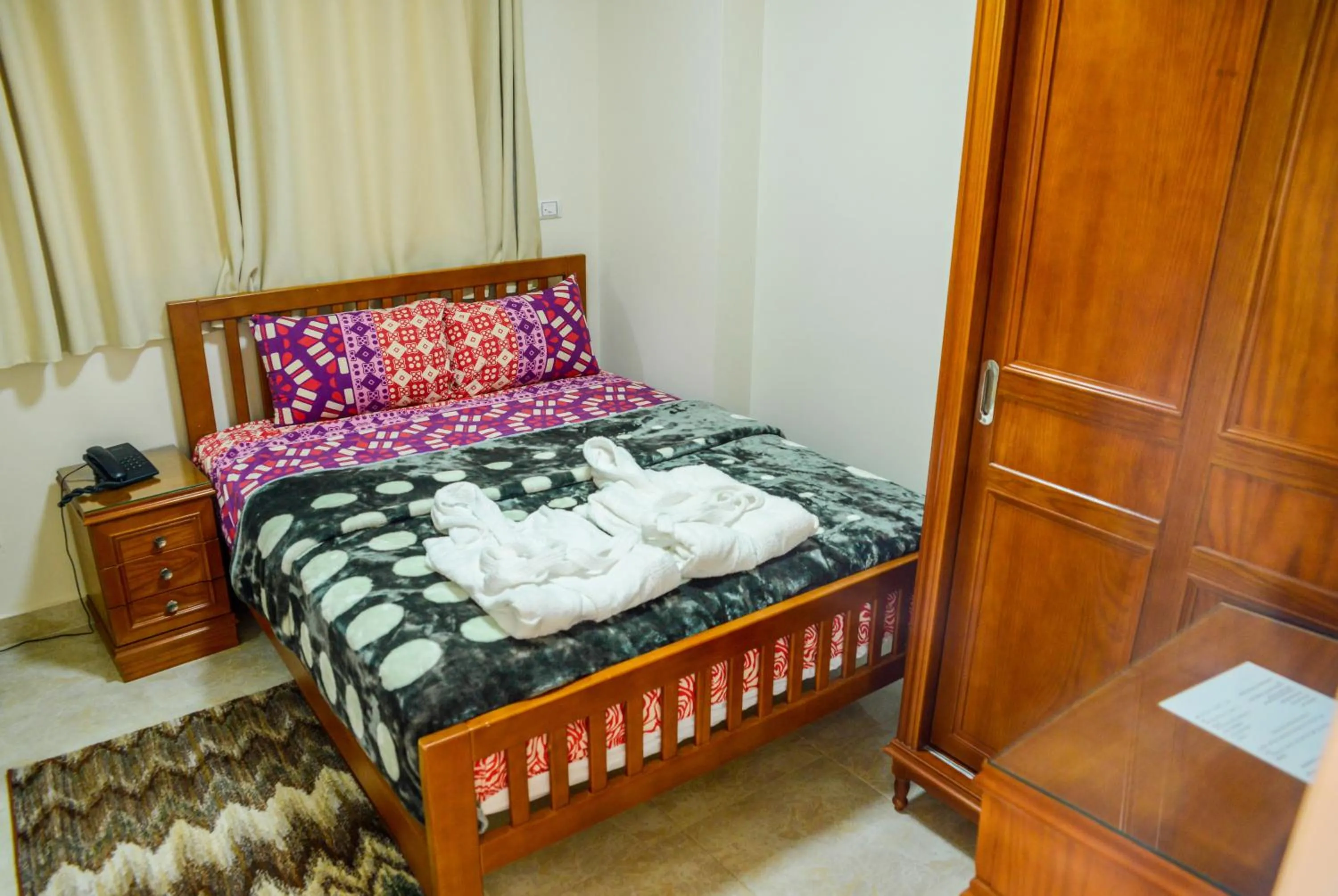 Bedroom, Bed in Al Raya Apartments