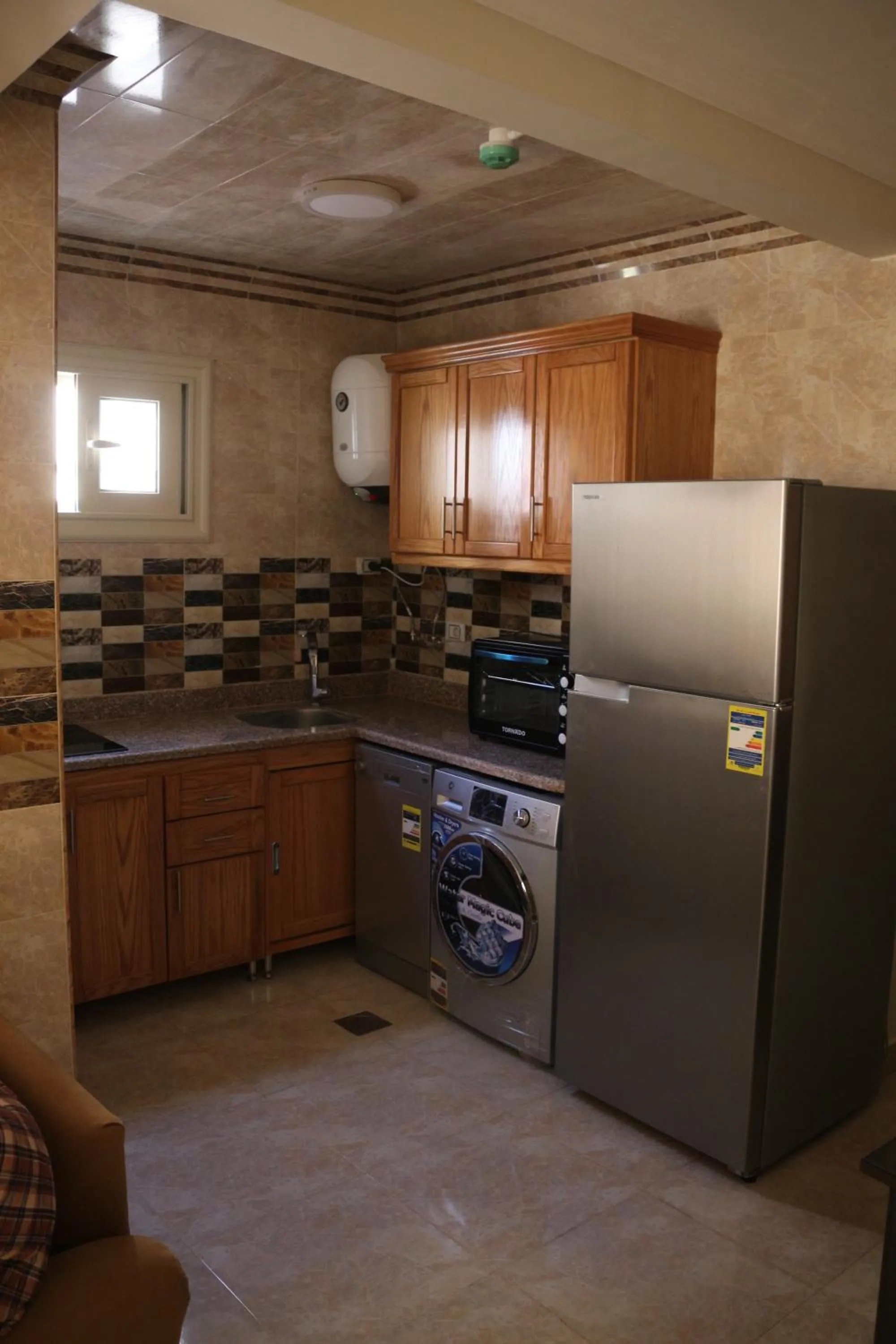 Kitchen or kitchenette in Al Raya Apartments