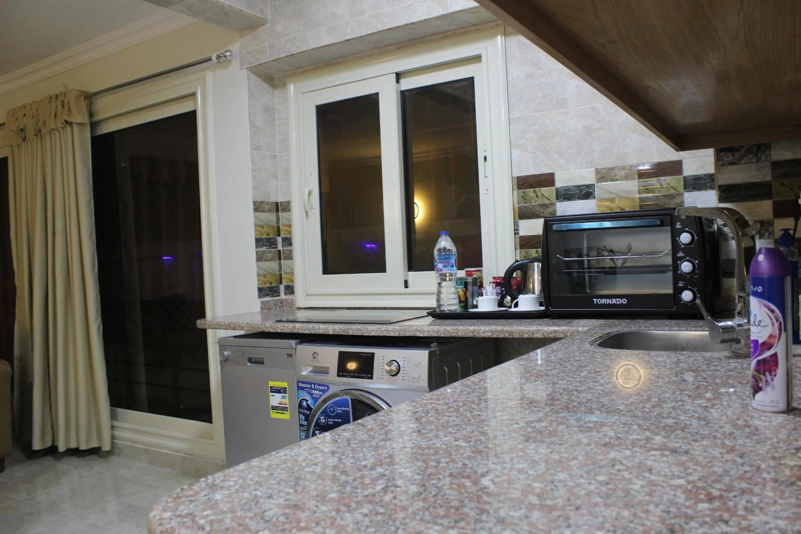 Kitchen or kitchenette in Al Raya Apartments