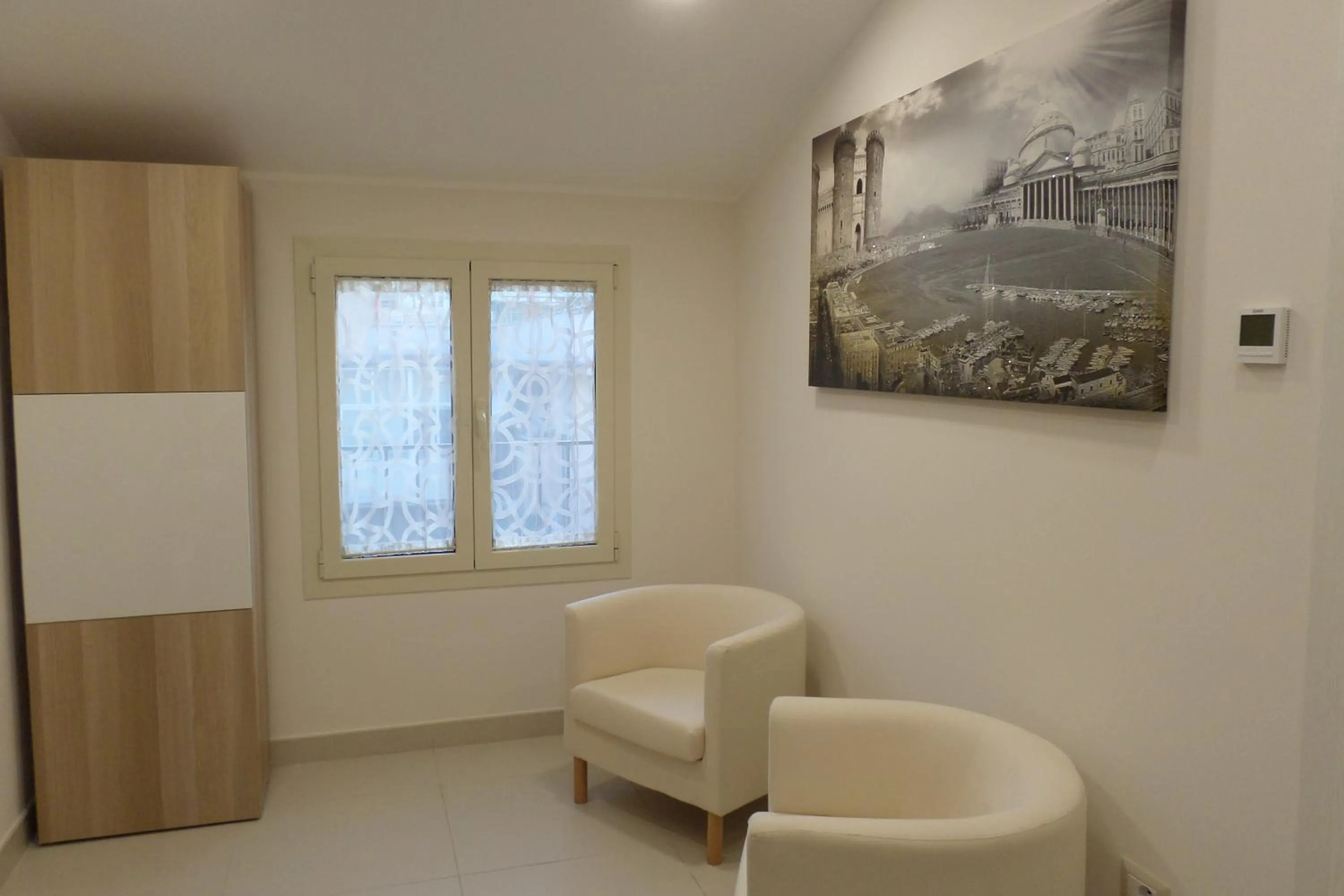 Communal lounge/ TV room in B&B Mansarda del Sole