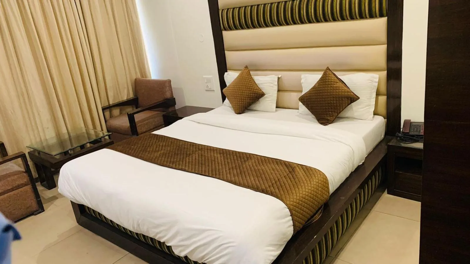 Photo of the whole room, Bed in Hotel Landmark - Centre of City Chandigarh