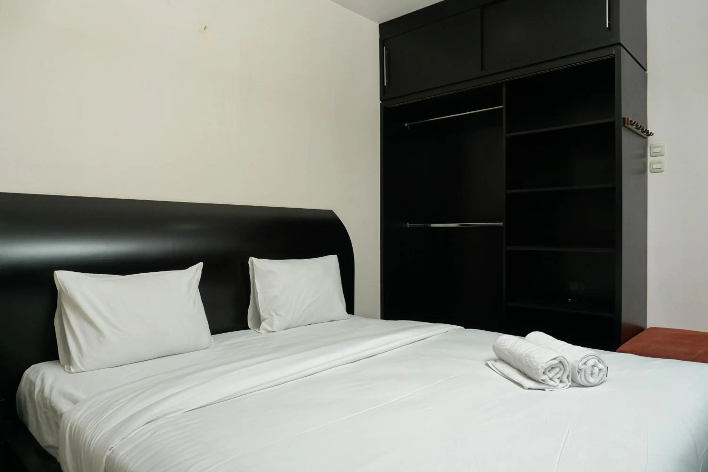 Bed in Big and Cozy Studio Apartment at Puri Garden By Travelio