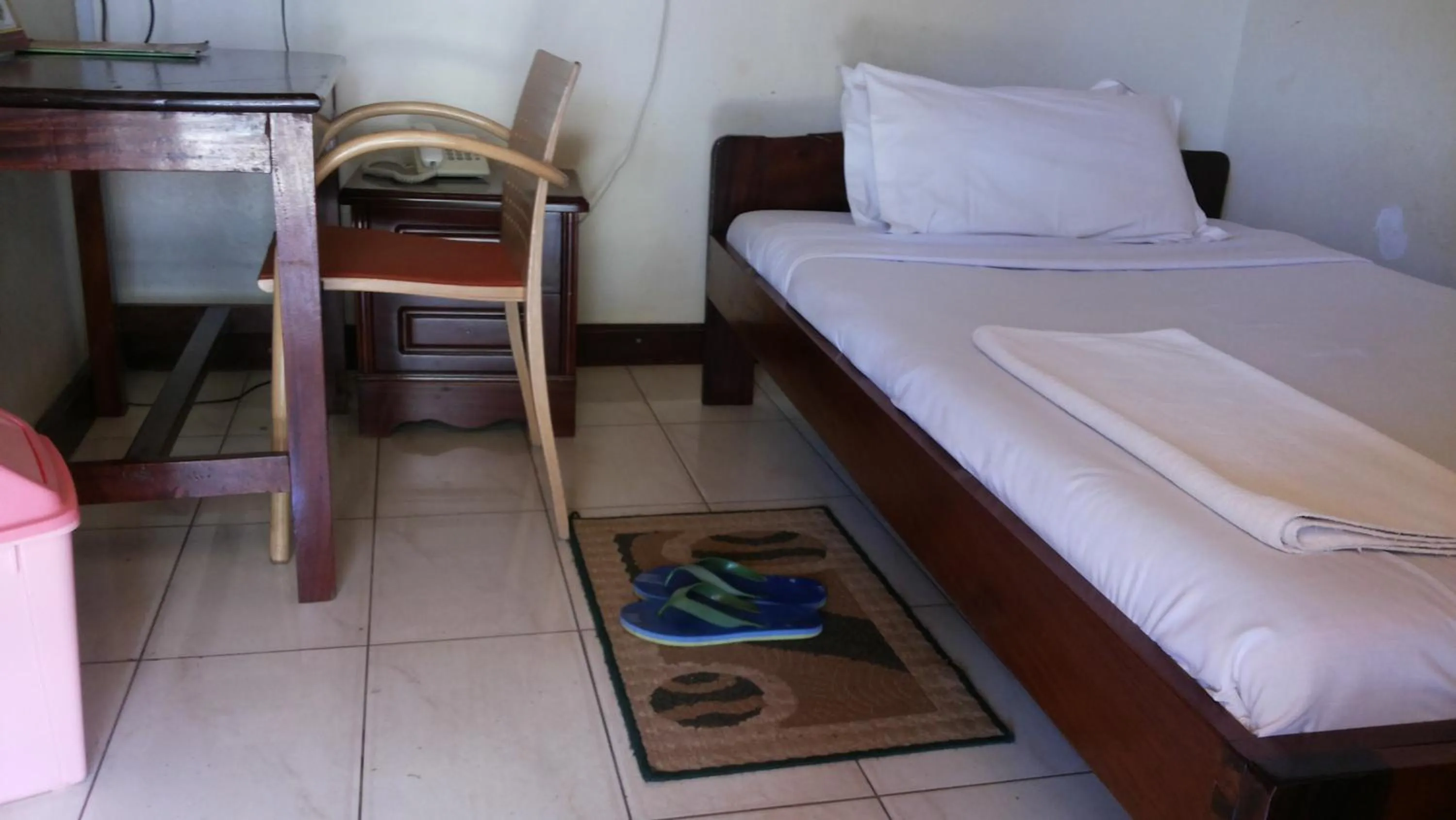 Bedroom in Zawadi Hotel