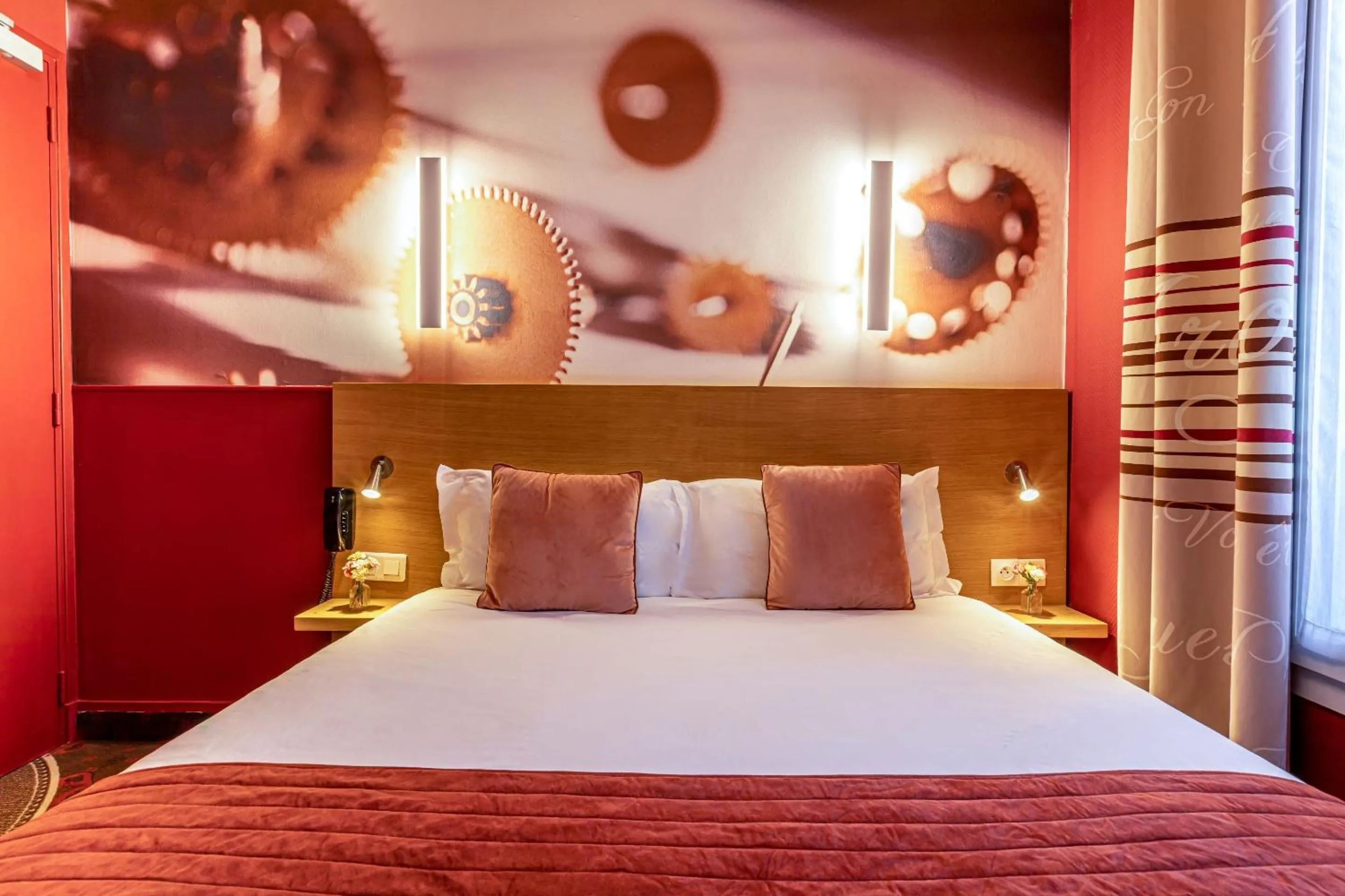 Bed in Hotel Ariane Montparnasse by Patrick Hayat