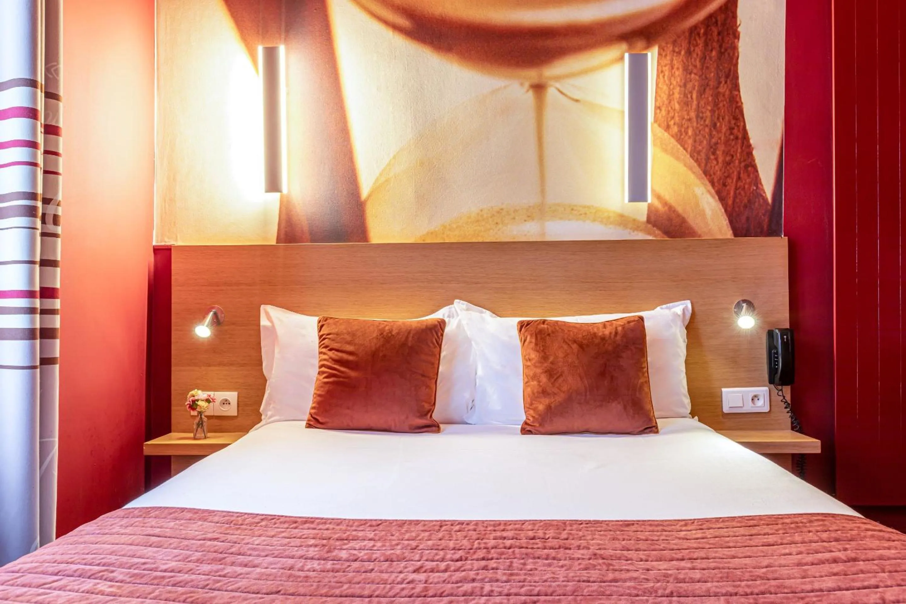 Bed in Hotel Ariane Montparnasse by Patrick Hayat