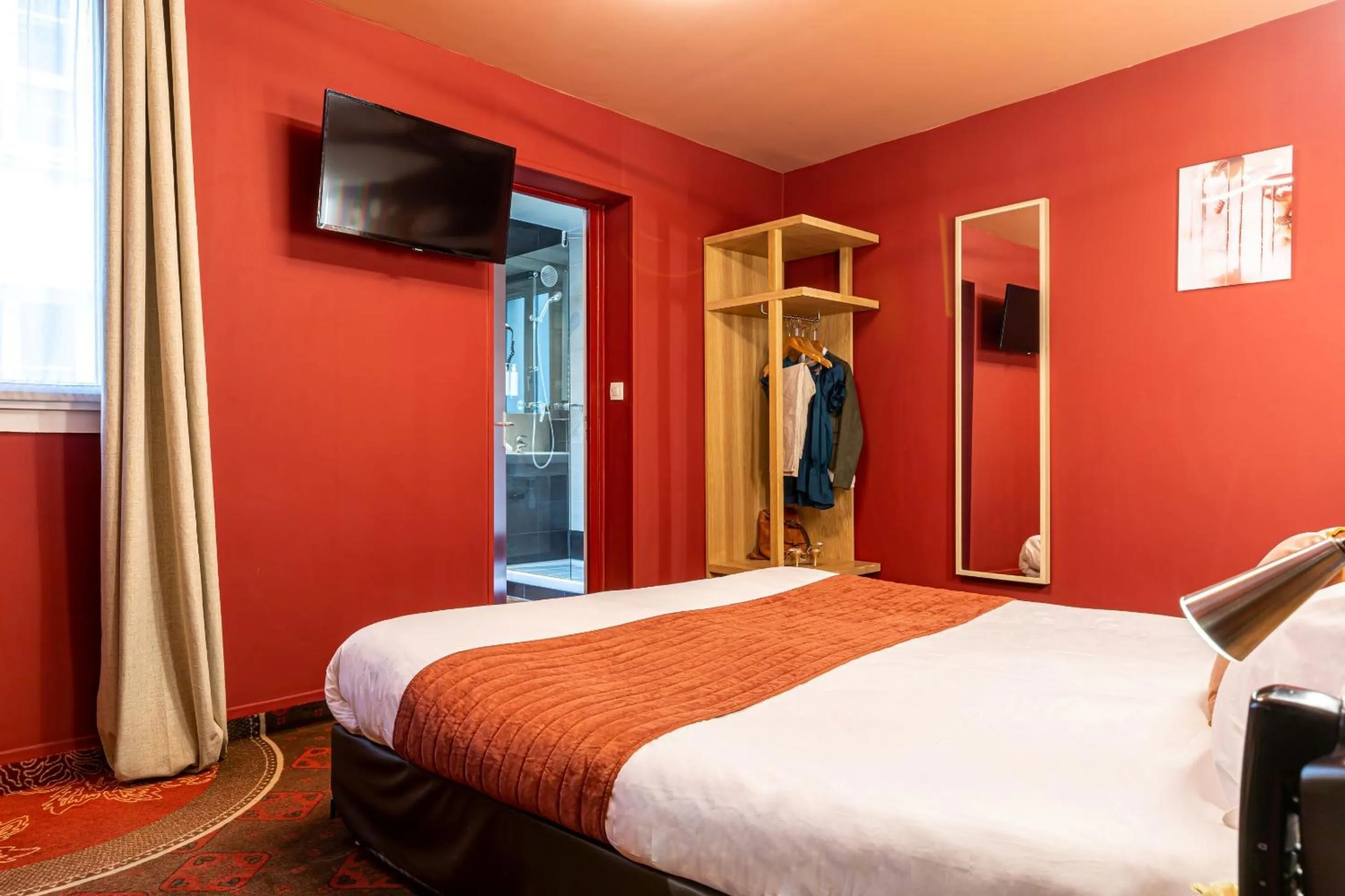 Bed in Hotel Ariane Montparnasse by Patrick Hayat