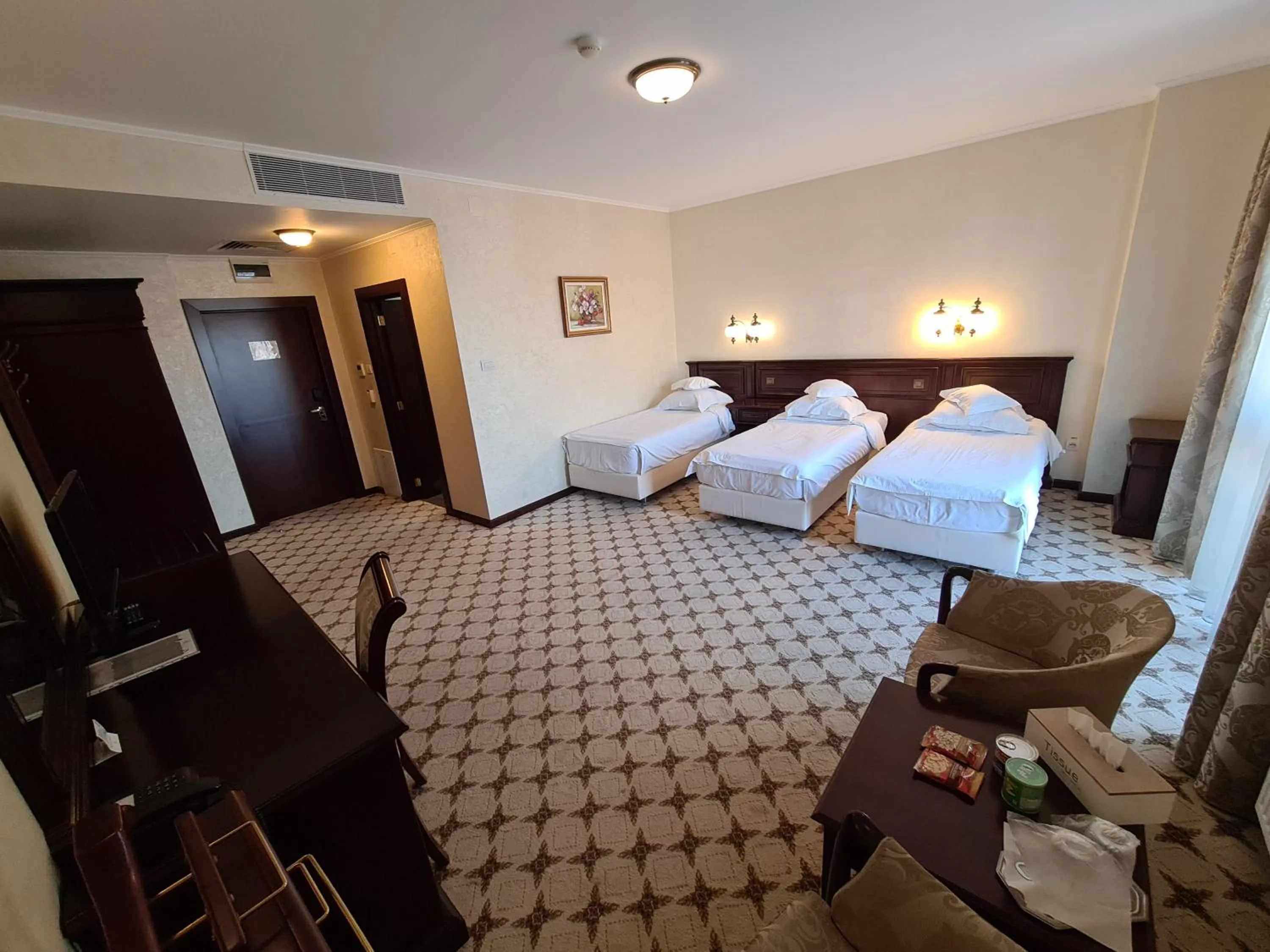 Seating area, Bed in Hotel Golden House