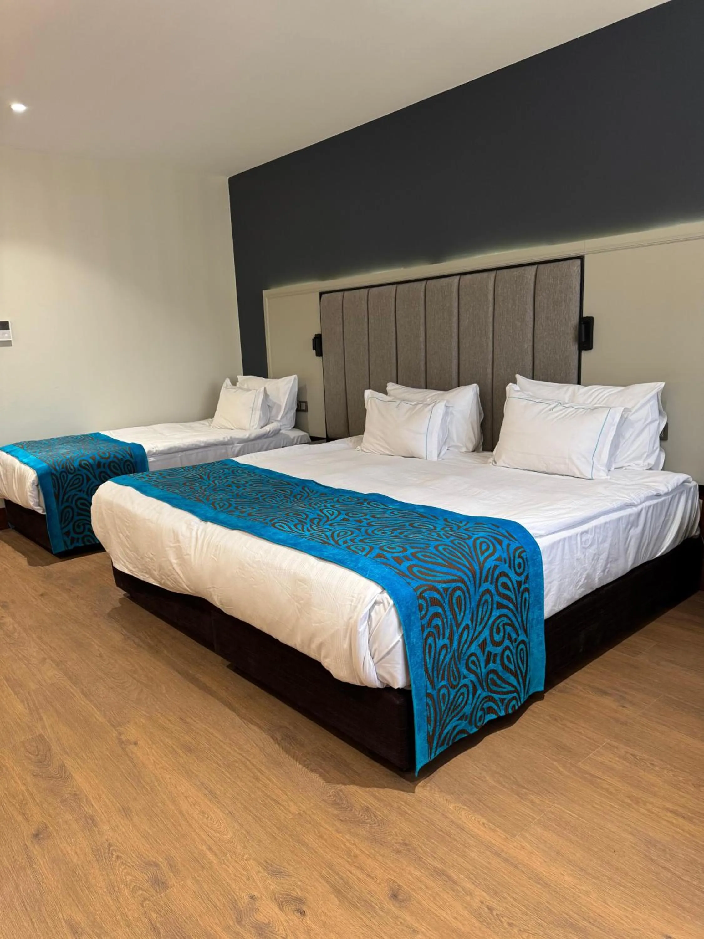 Bed in Teymur Continental Hotel