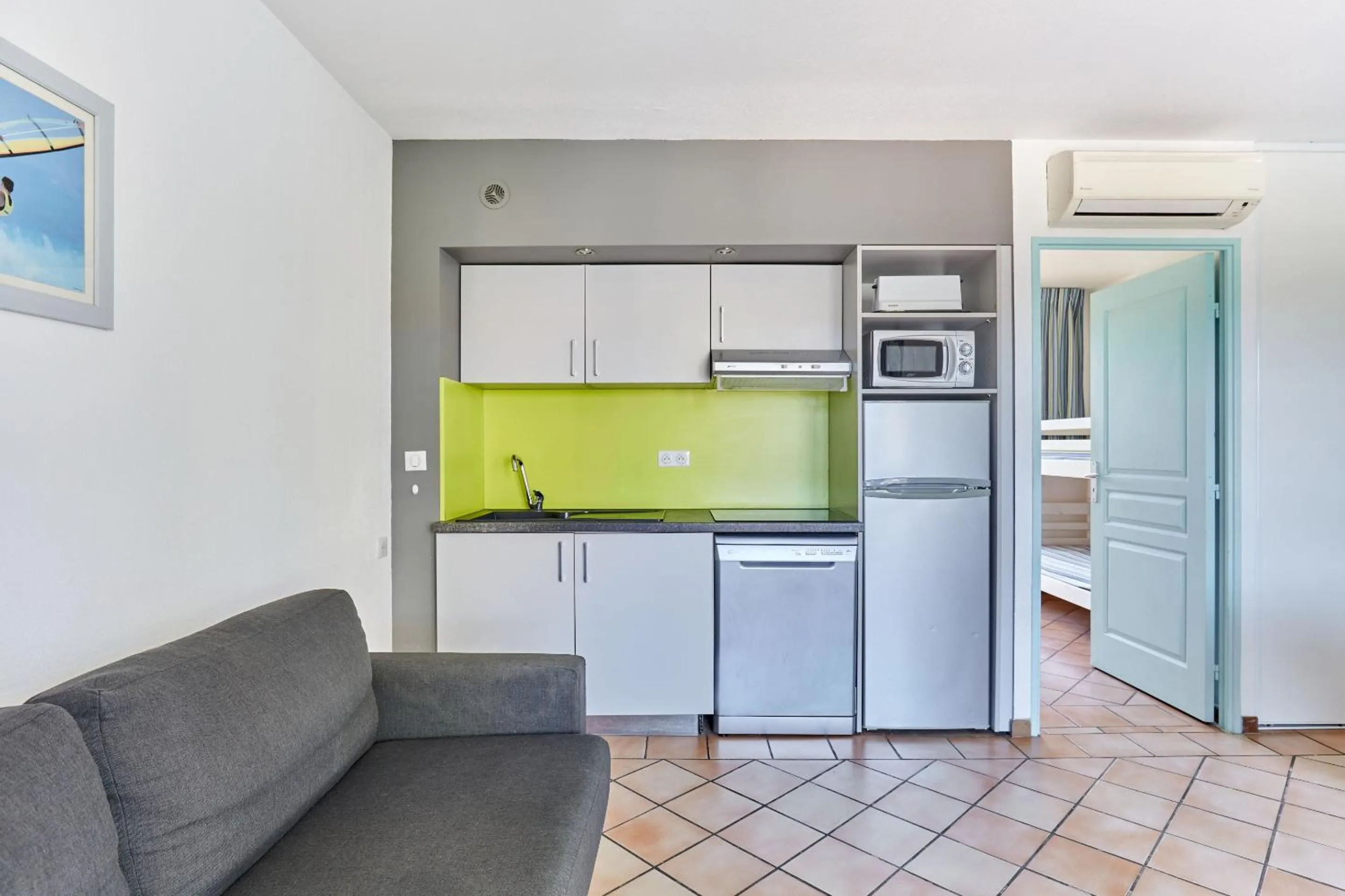 Kitchen or kitchenette in Résidence Odalys La Palmeraie