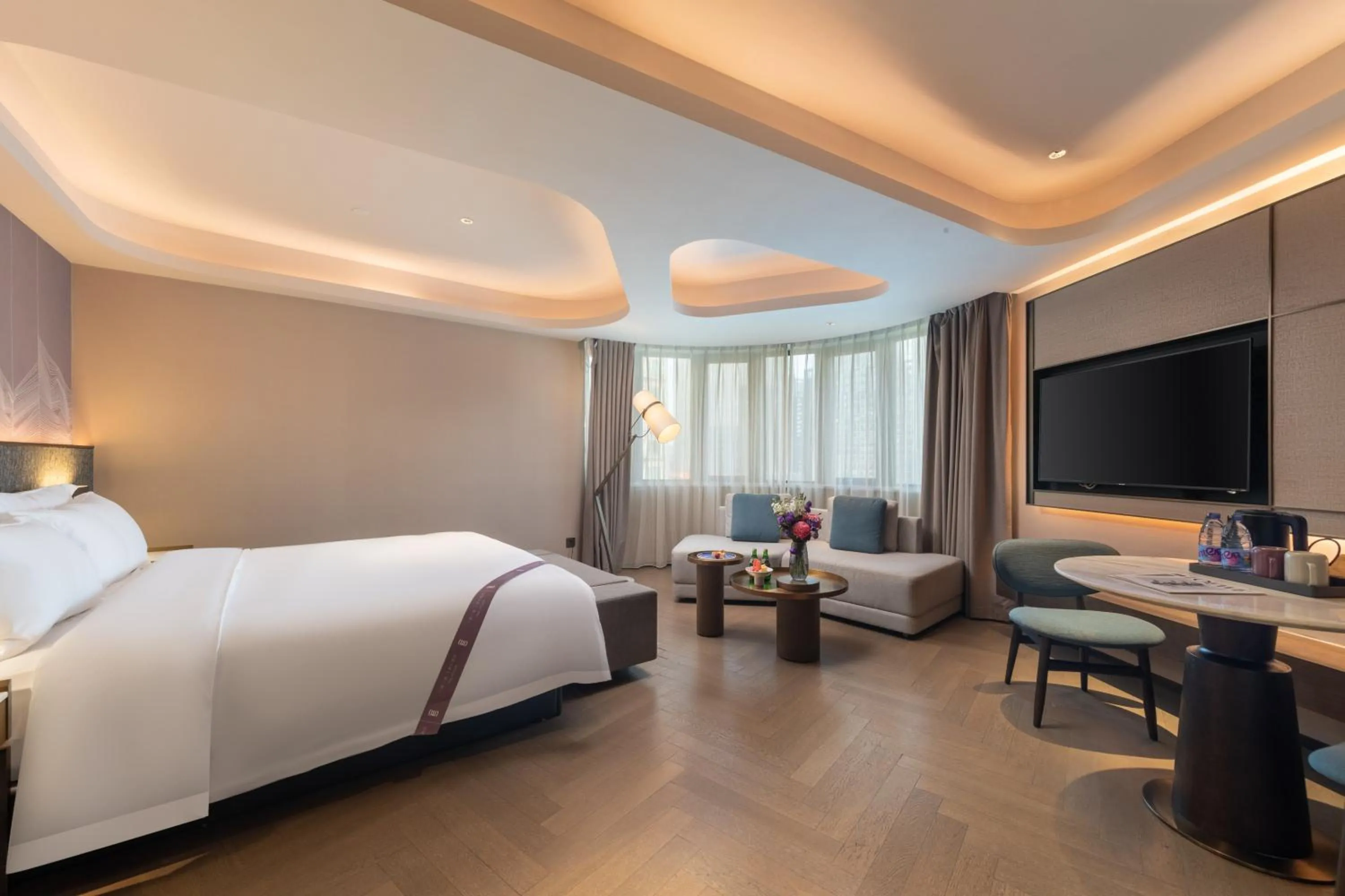 Seating area, Bed in Amber East Hotel