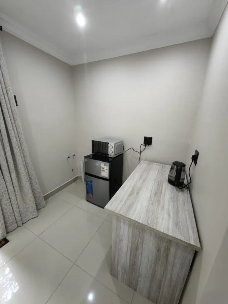 Kitchen or kitchenette in New Bali Guesthouse