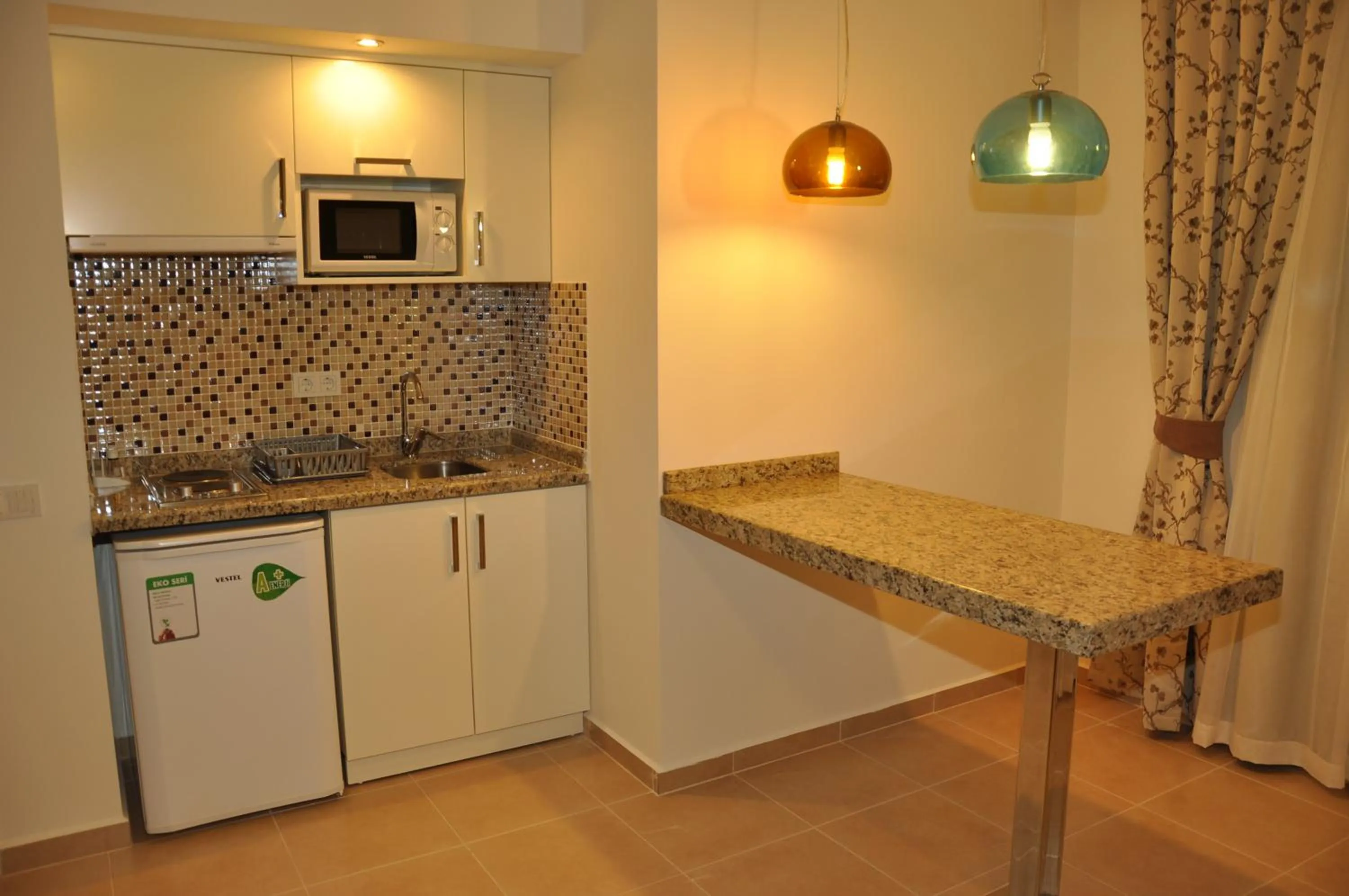 Kitchen or kitchenette in Almera Park Apart Hotel