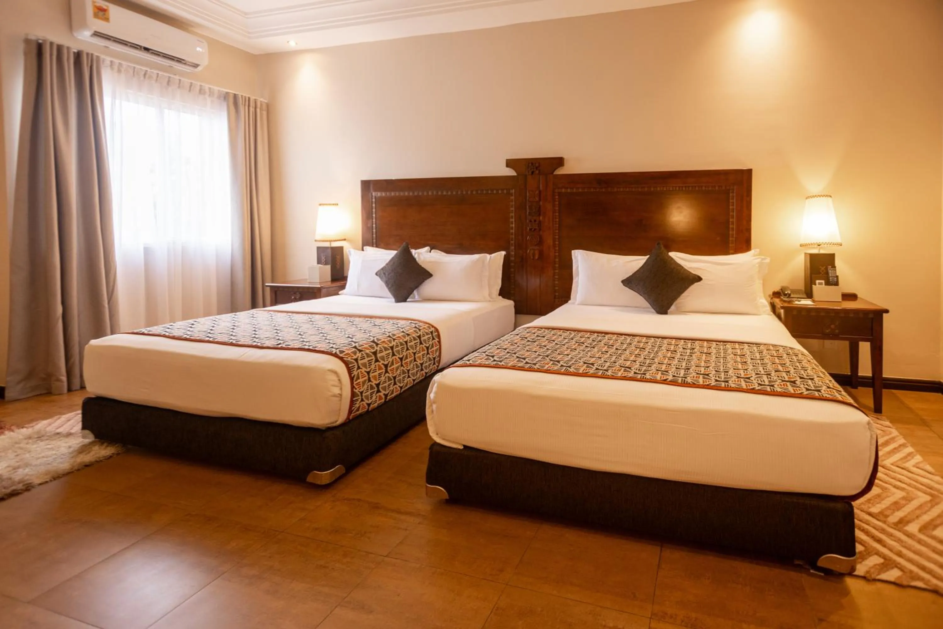 Bed in The African Regent Hotel